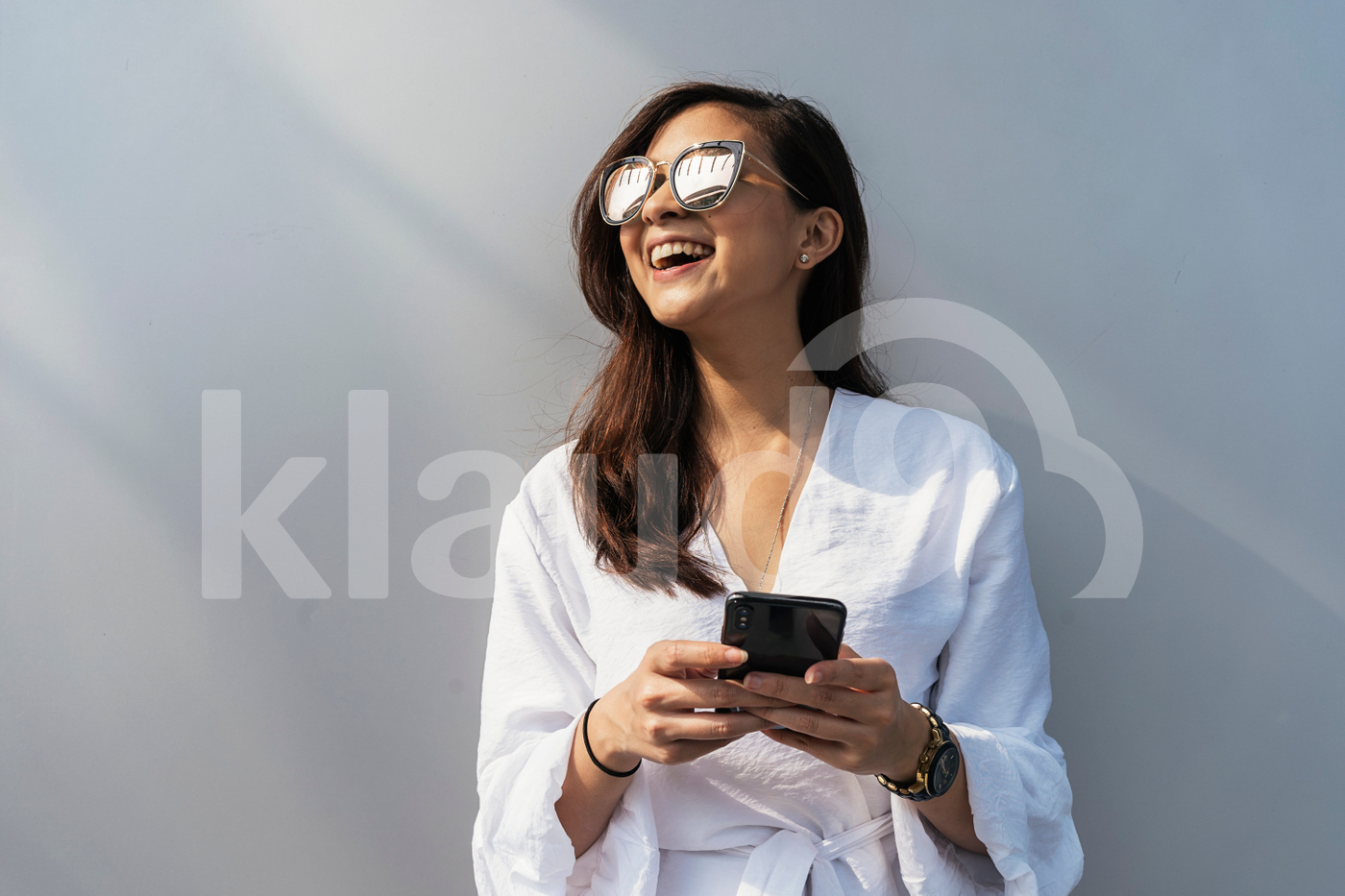 Portrait of beautiful Asian woman using mobile