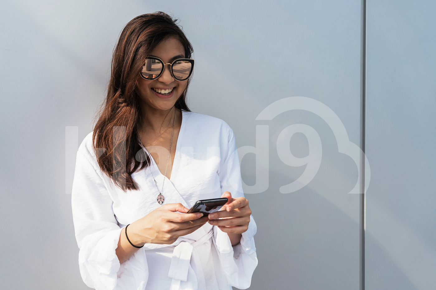 Portrait of beautiful Asian woman using smartphone