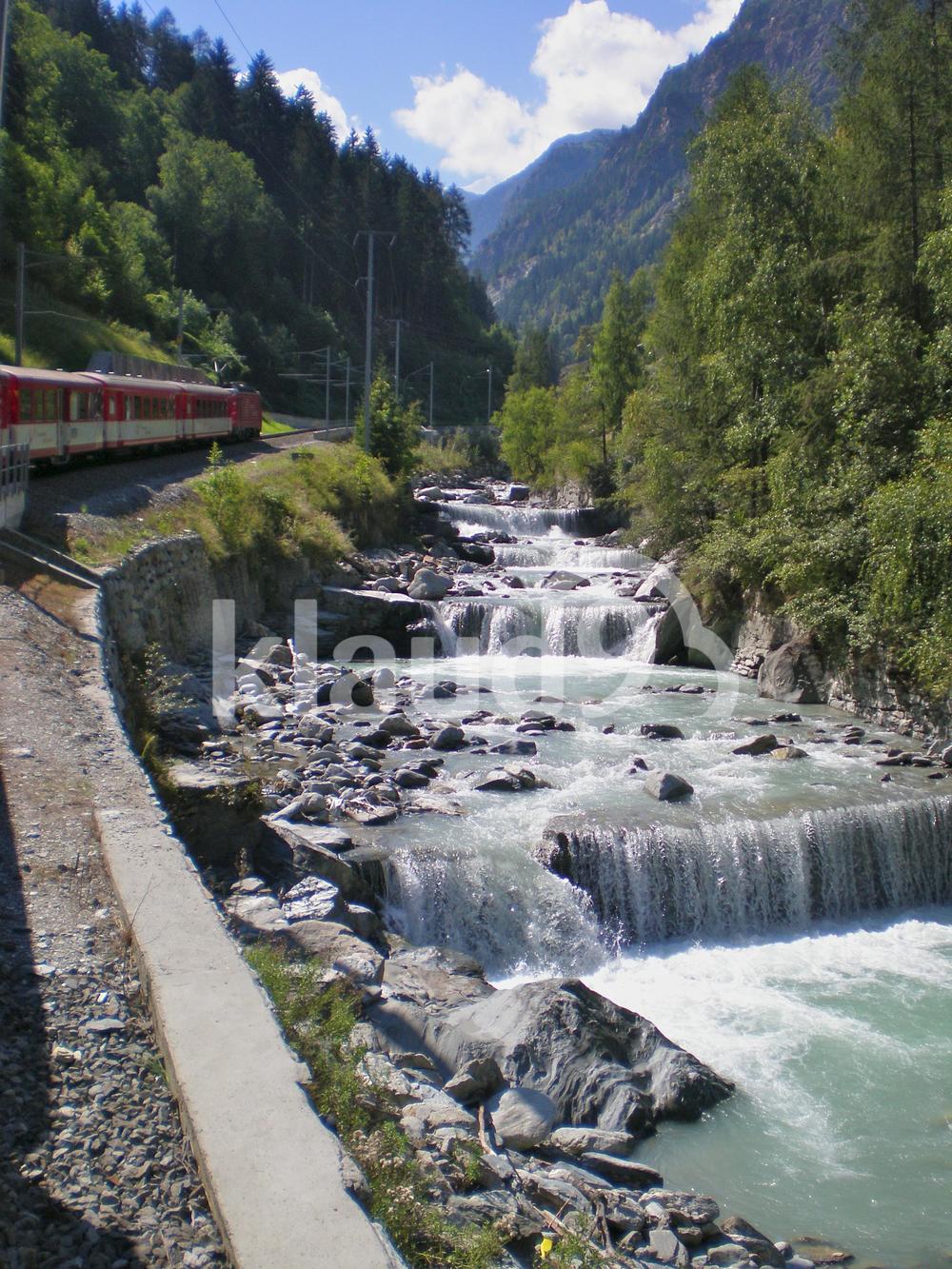 River beside train track Switzerland