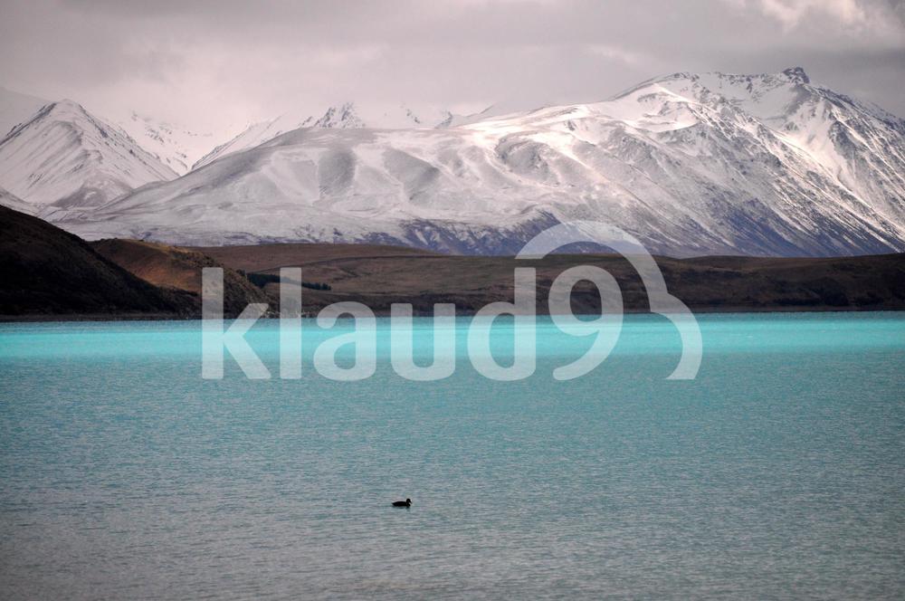 Snow mountain and crystal blue water