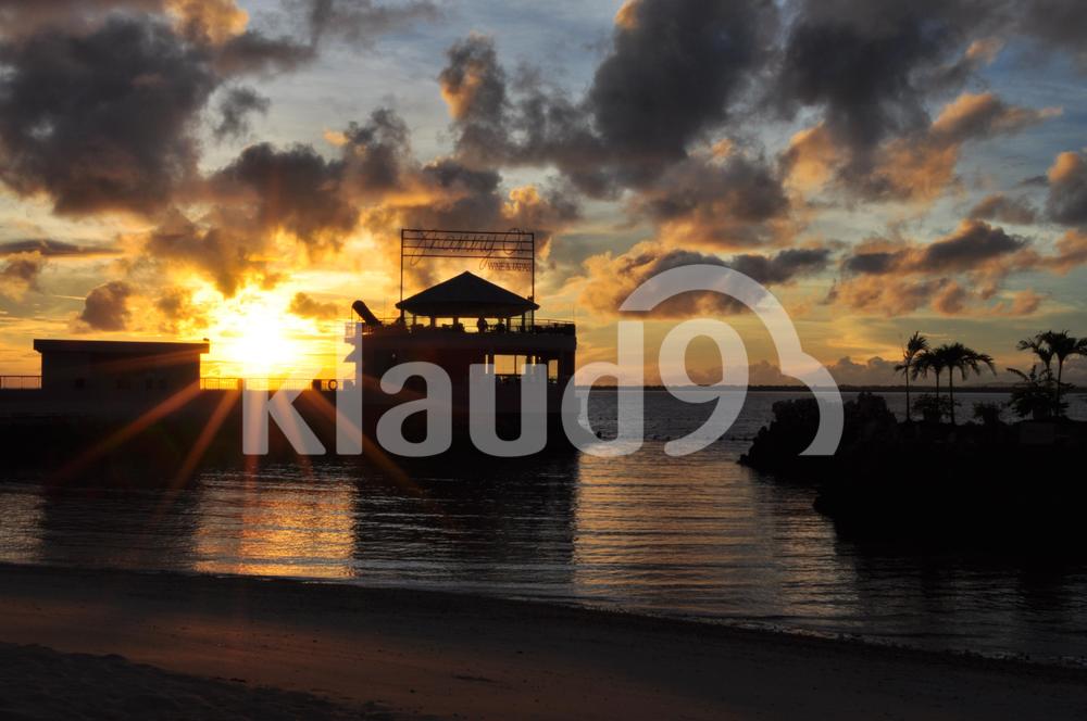 sunset view in Cebu island with trees and a restaurant