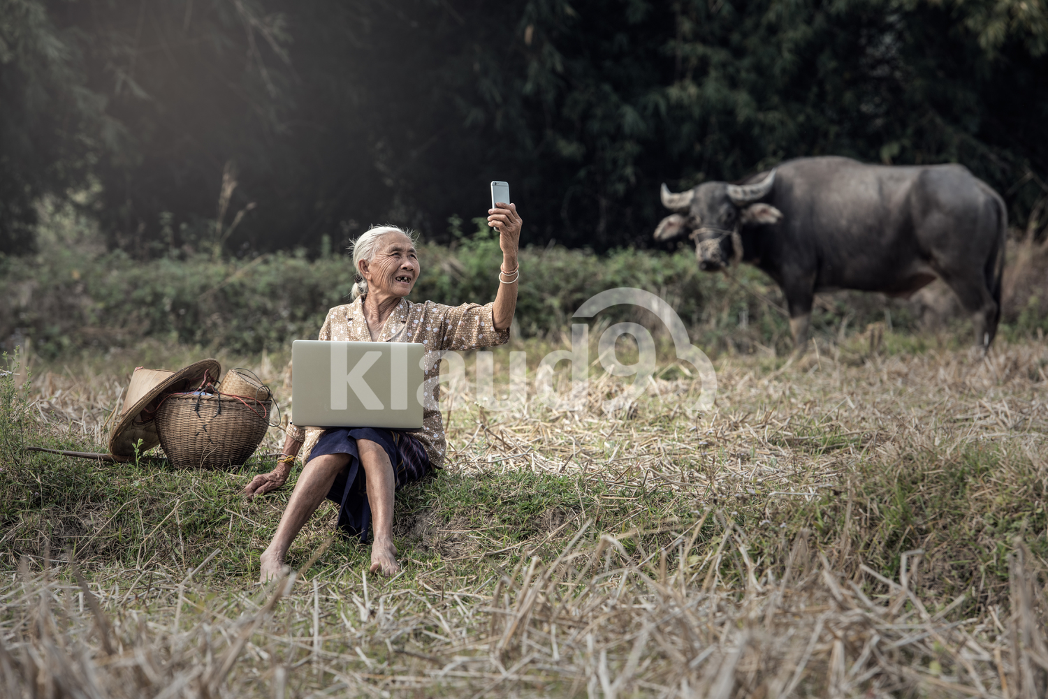 Grandmother taking a selfie in the countryside of Thailand