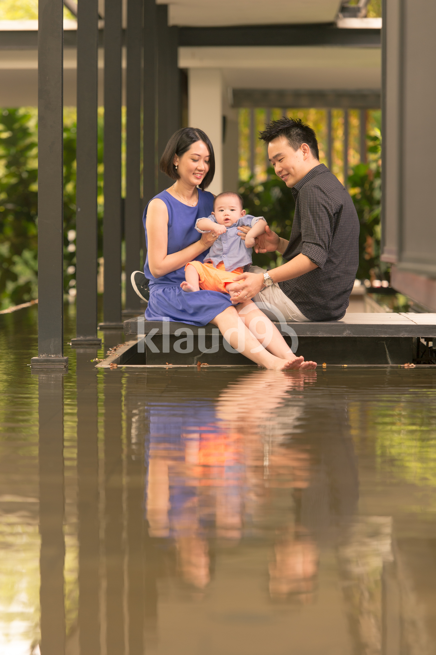 Youthful Chinese family with 5 month old baby
