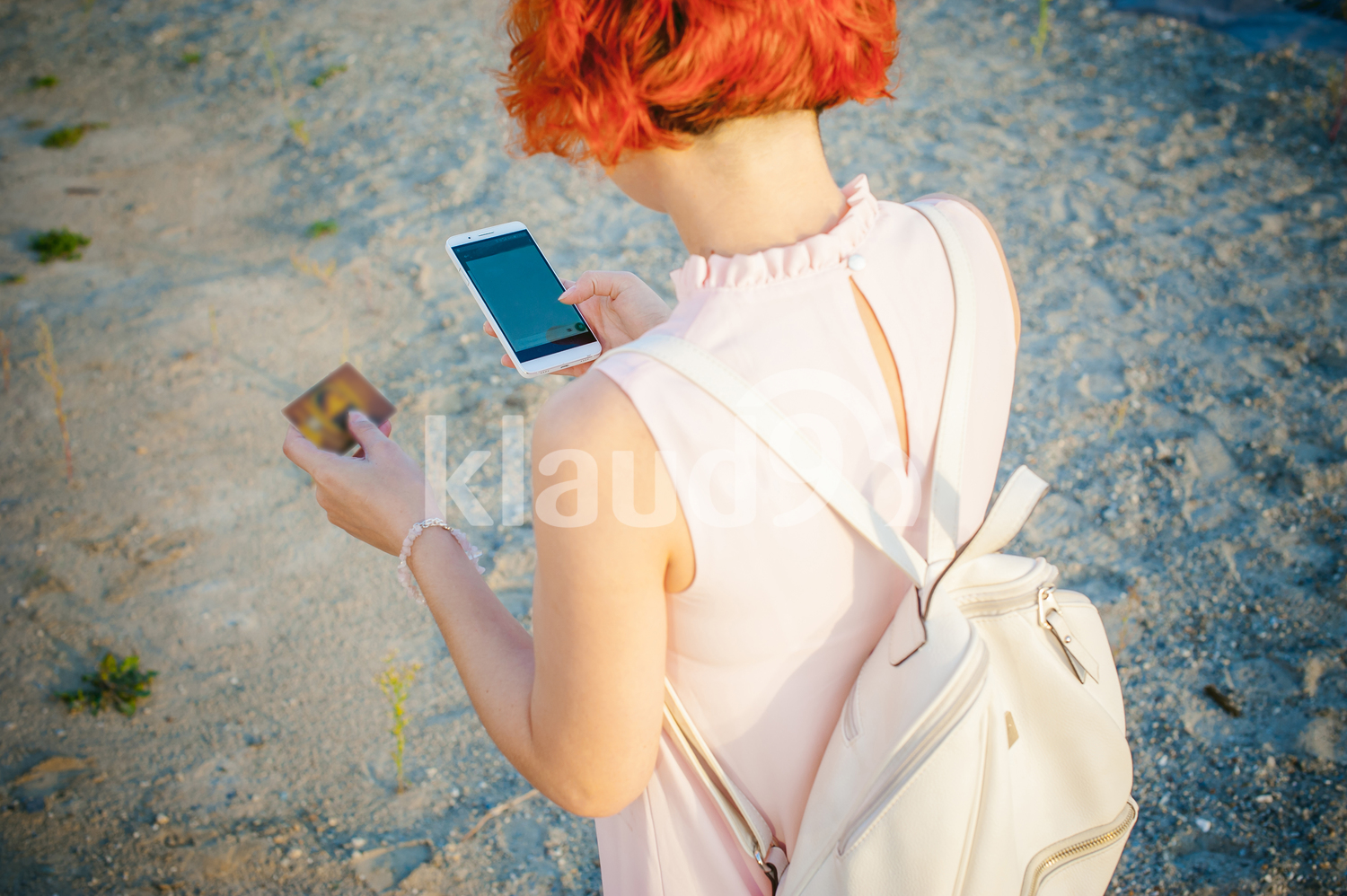 Back view of lady making online transactions