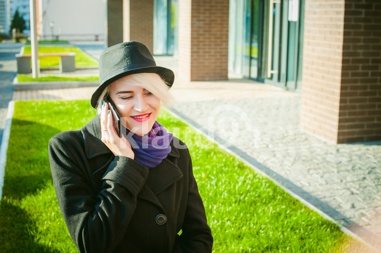 Beautiful young lady on her cellphone