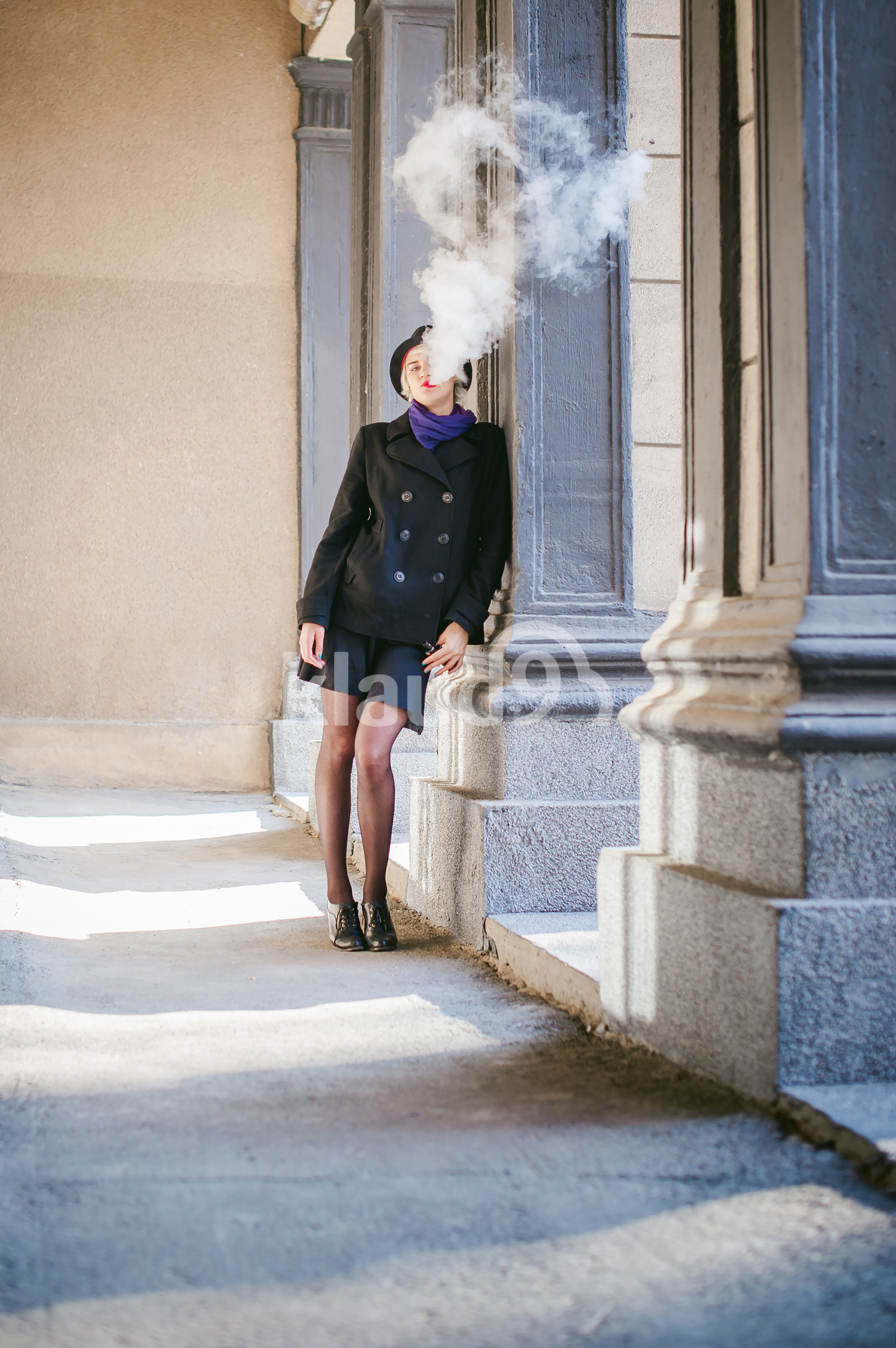 portrait of young beautiful woman with white hair vaping away