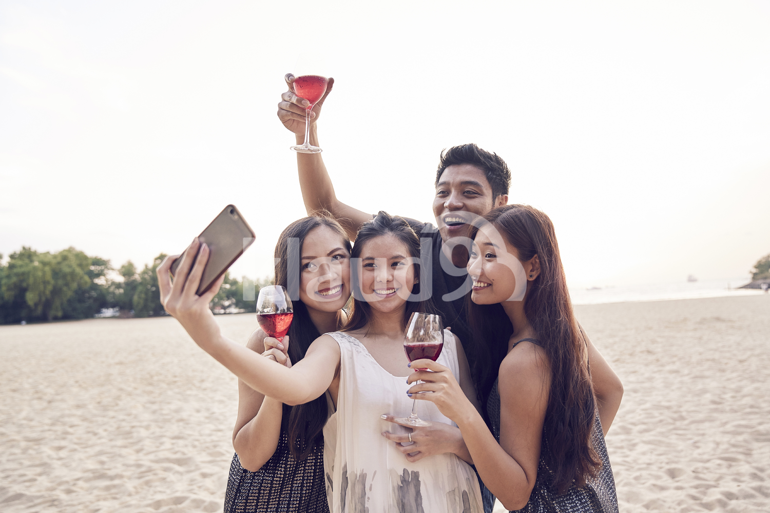Group of friends taking a selfie at Sentosa, Singapore