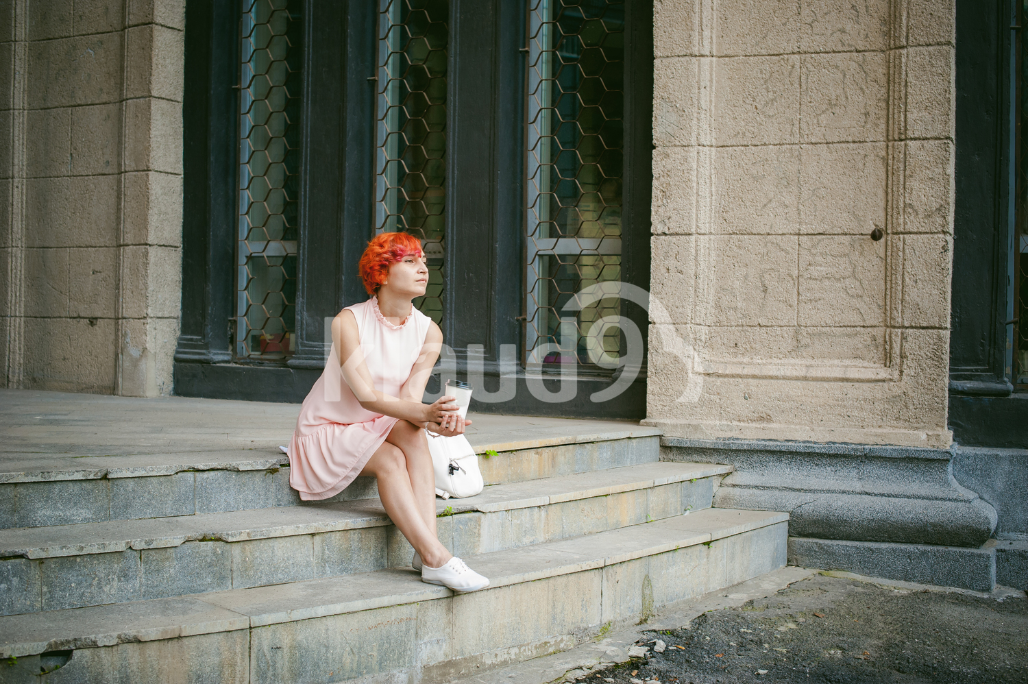 Woman looking forlorn with a coffee cup