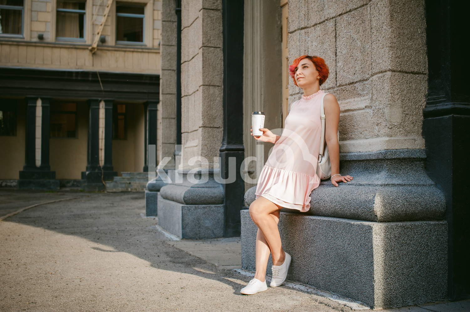 Woman sipping coffee on the streets