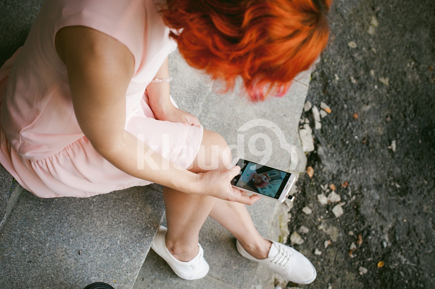 Red haired girl doing a selfie