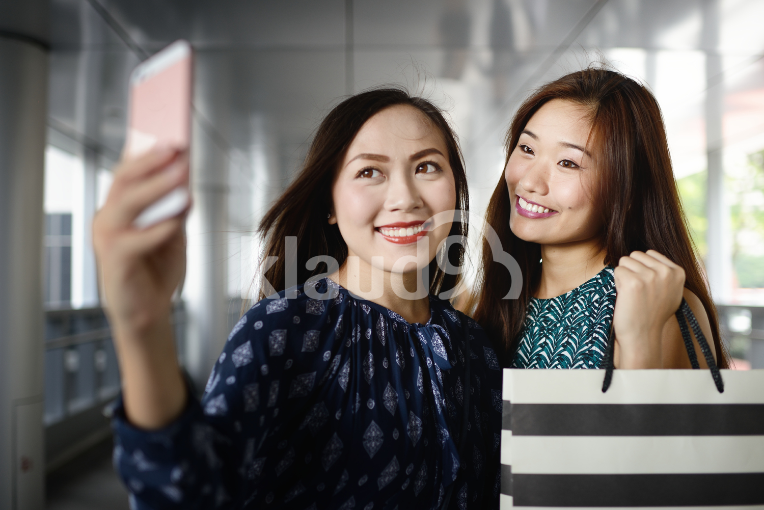 Two women taking a selfie while shopping