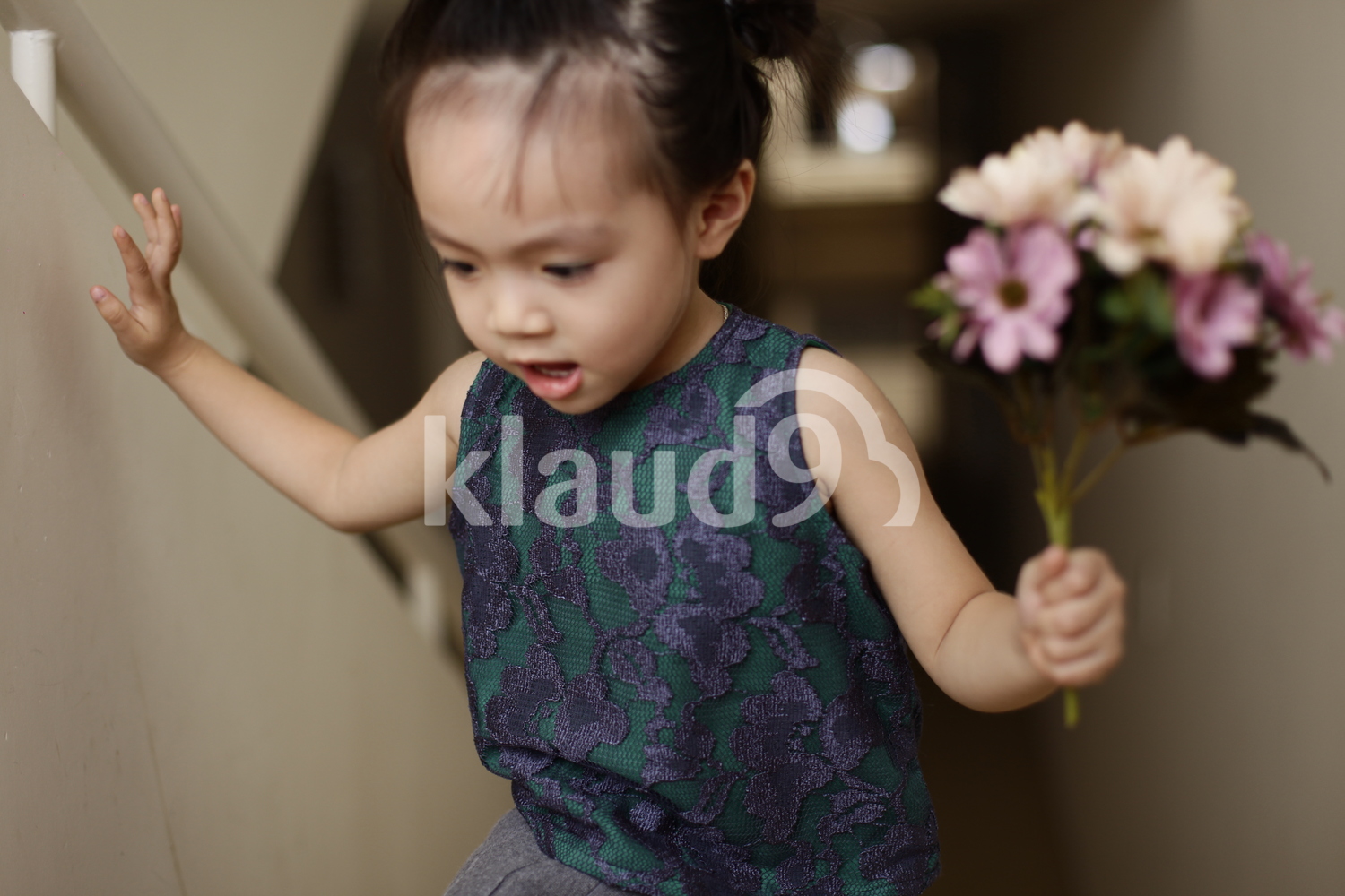 Cute Vietnamese girl ascending the stairs