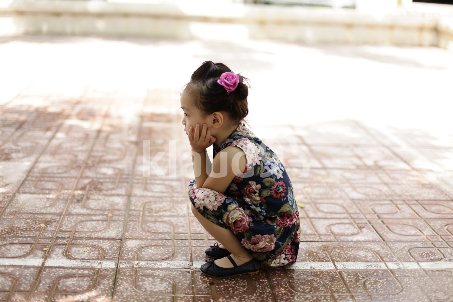 Cute little girl in a floral dress