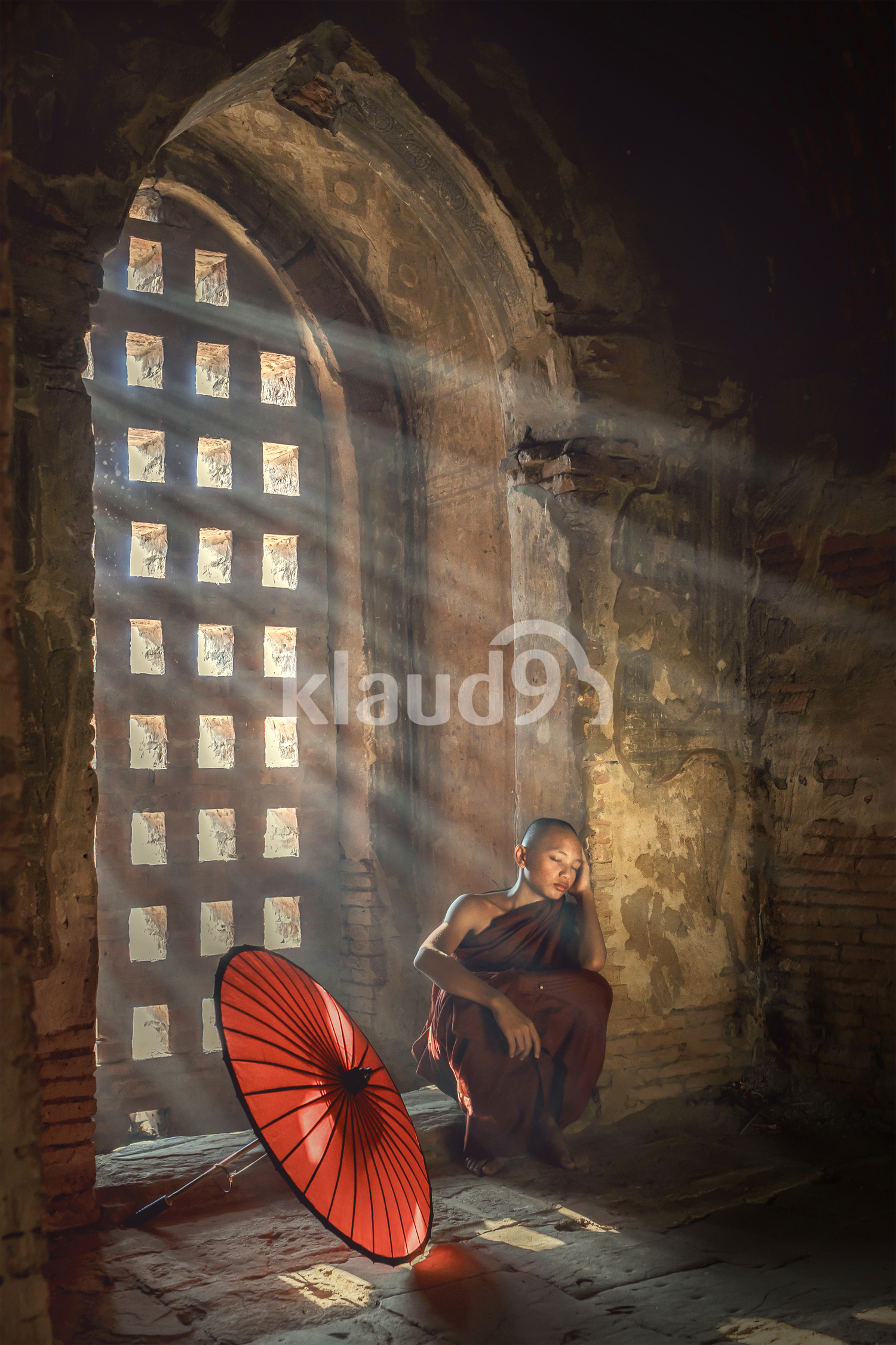 Young buddhist monk taking a break
