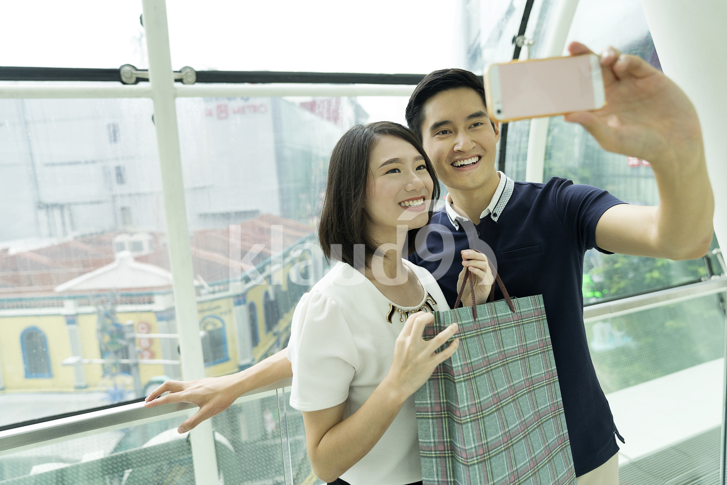 Young Chinese Couple Taking a Selfie along Orchard Road