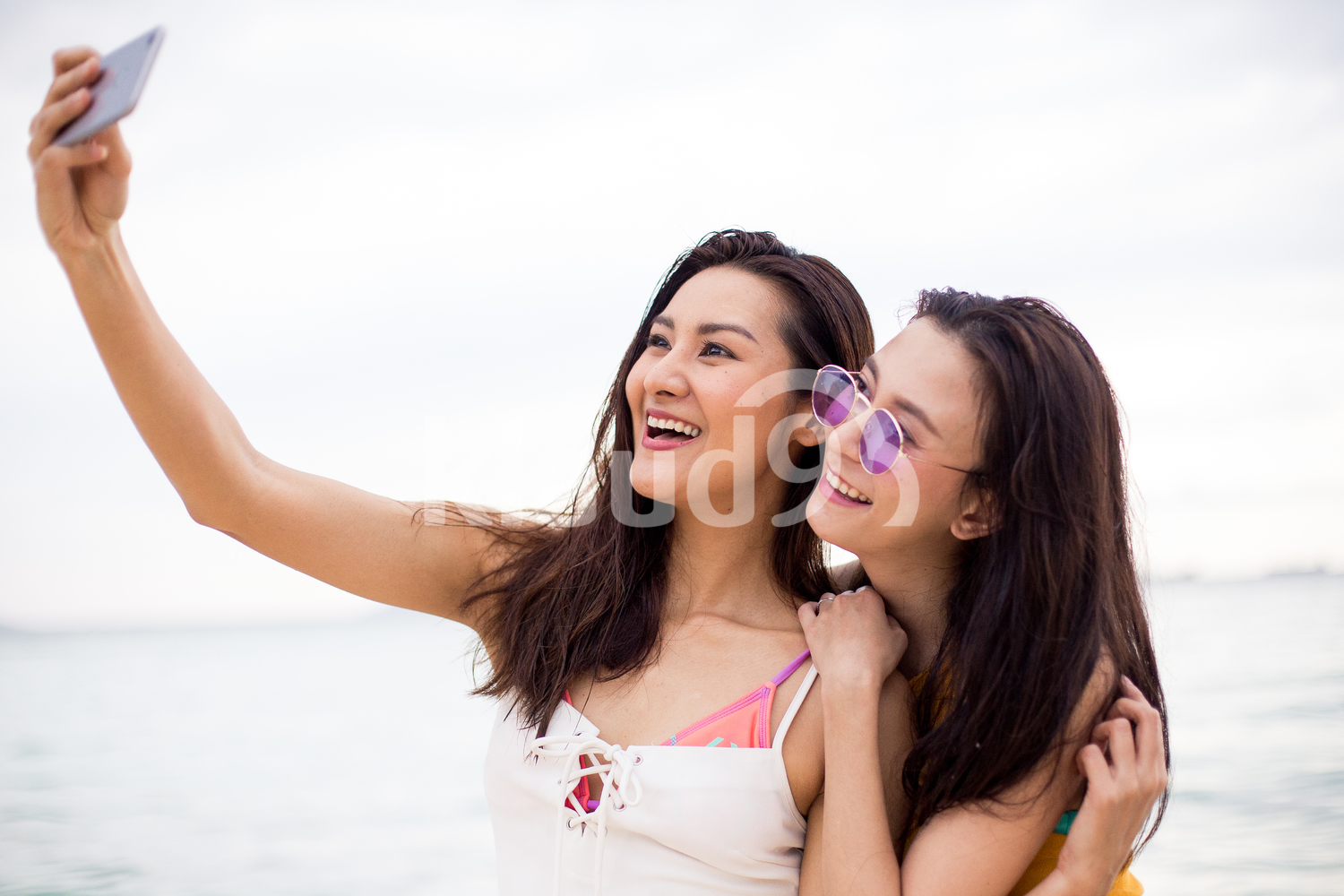 Friends shooting a selfie on the beach