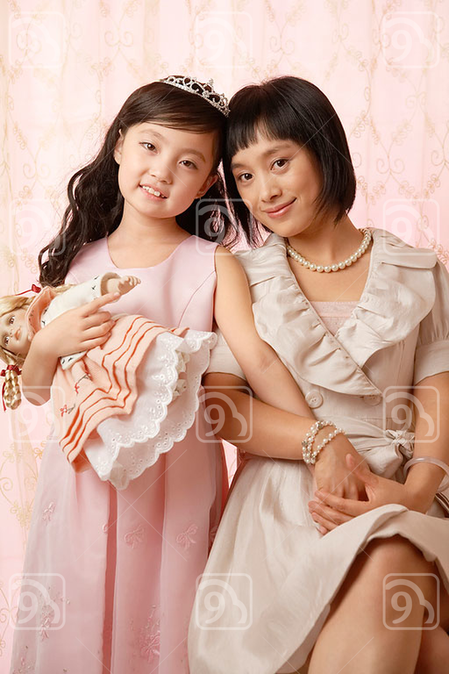 Chinese mother and daughter posing for camera 