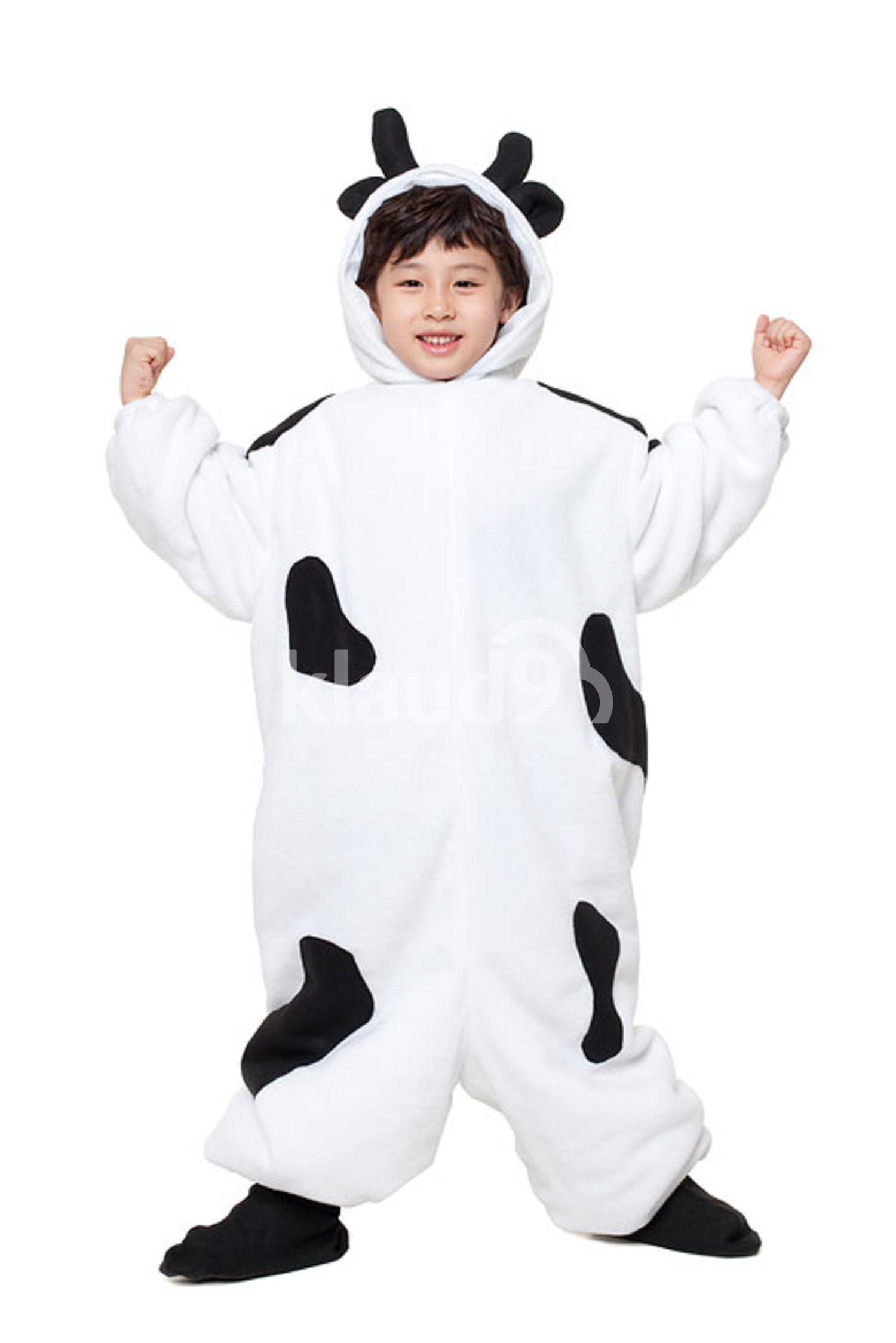 Cute Chinese boy in cow costume flexing his muscles
