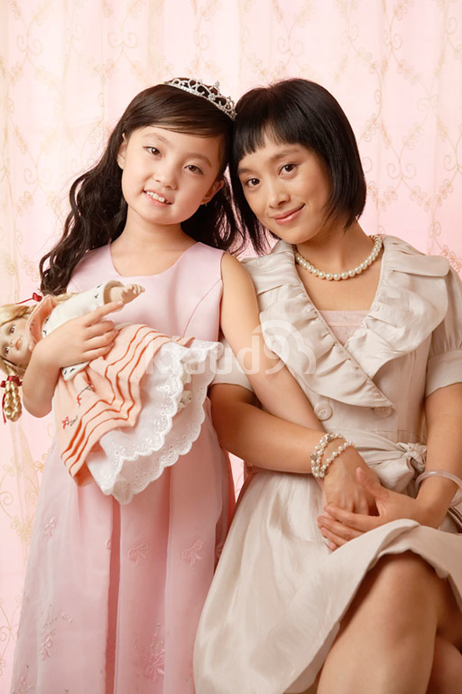 Chinese mother and daughter posing for camera