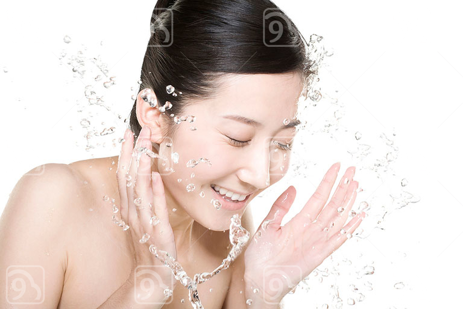 Beautiful young Chinese woman washing face 