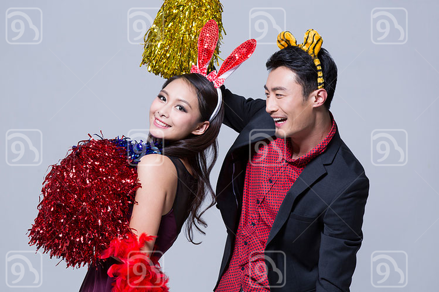 Happy young Chinese couple at a party 