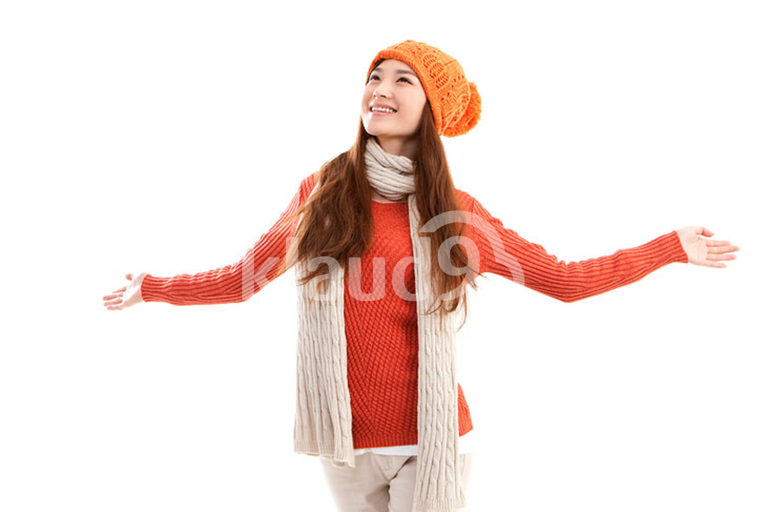 Young Chinese woman arms outstretched