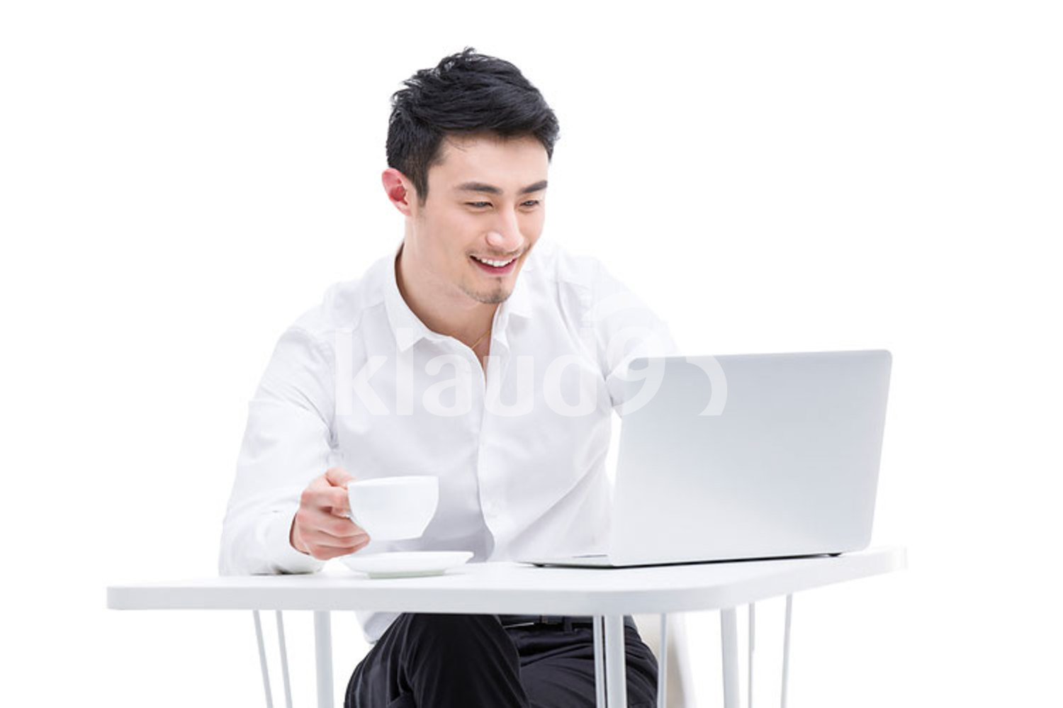 Young Chinese businessman using laptop