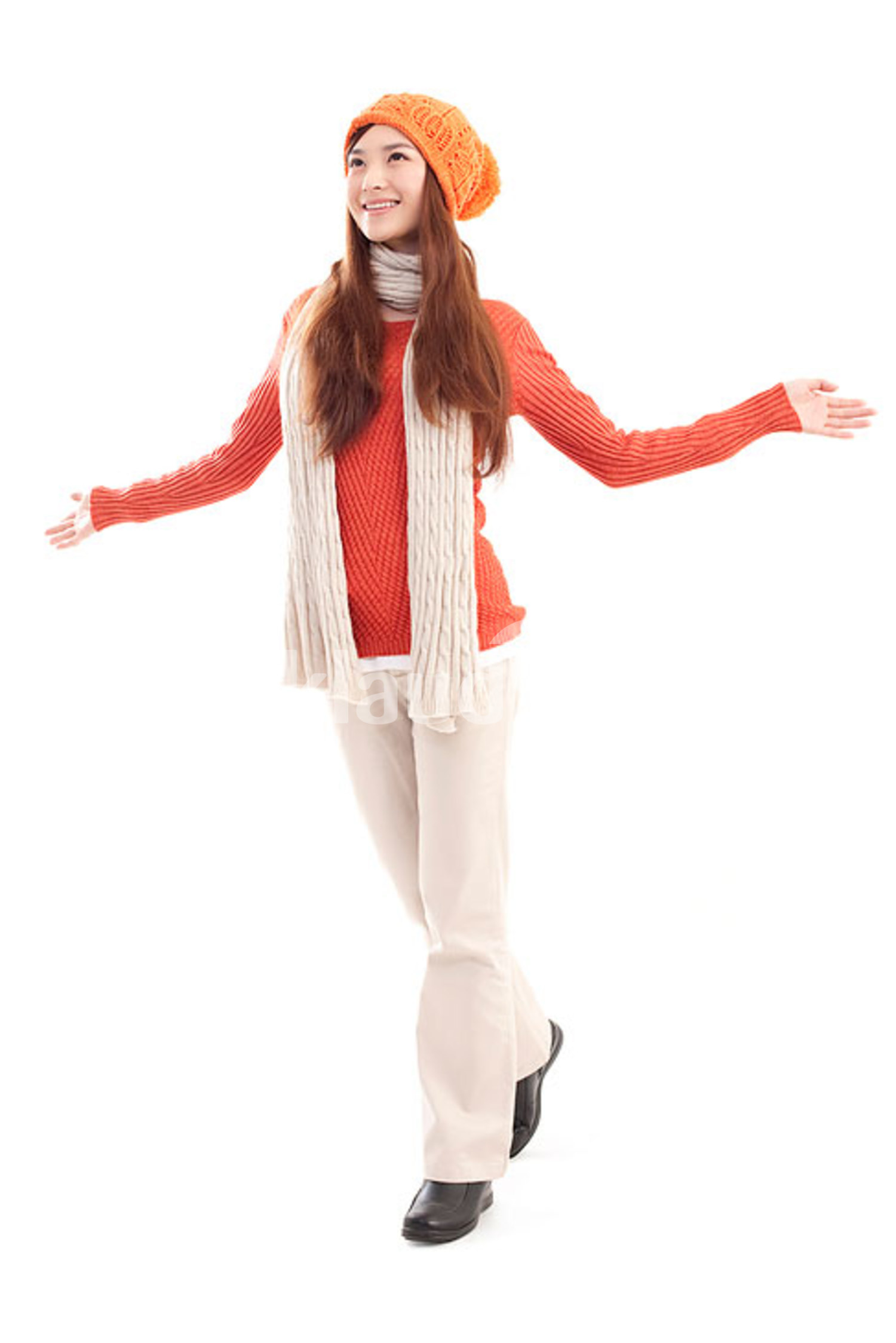 Happy young Chinese woman arms outstretched