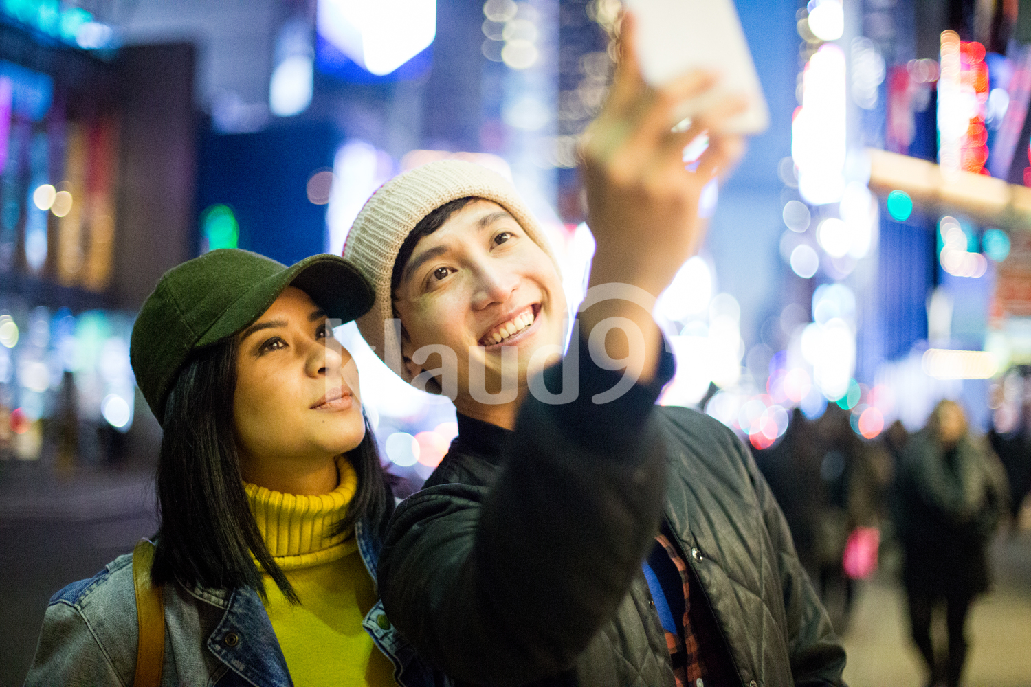 Asian tourists take a selfie in Time Square