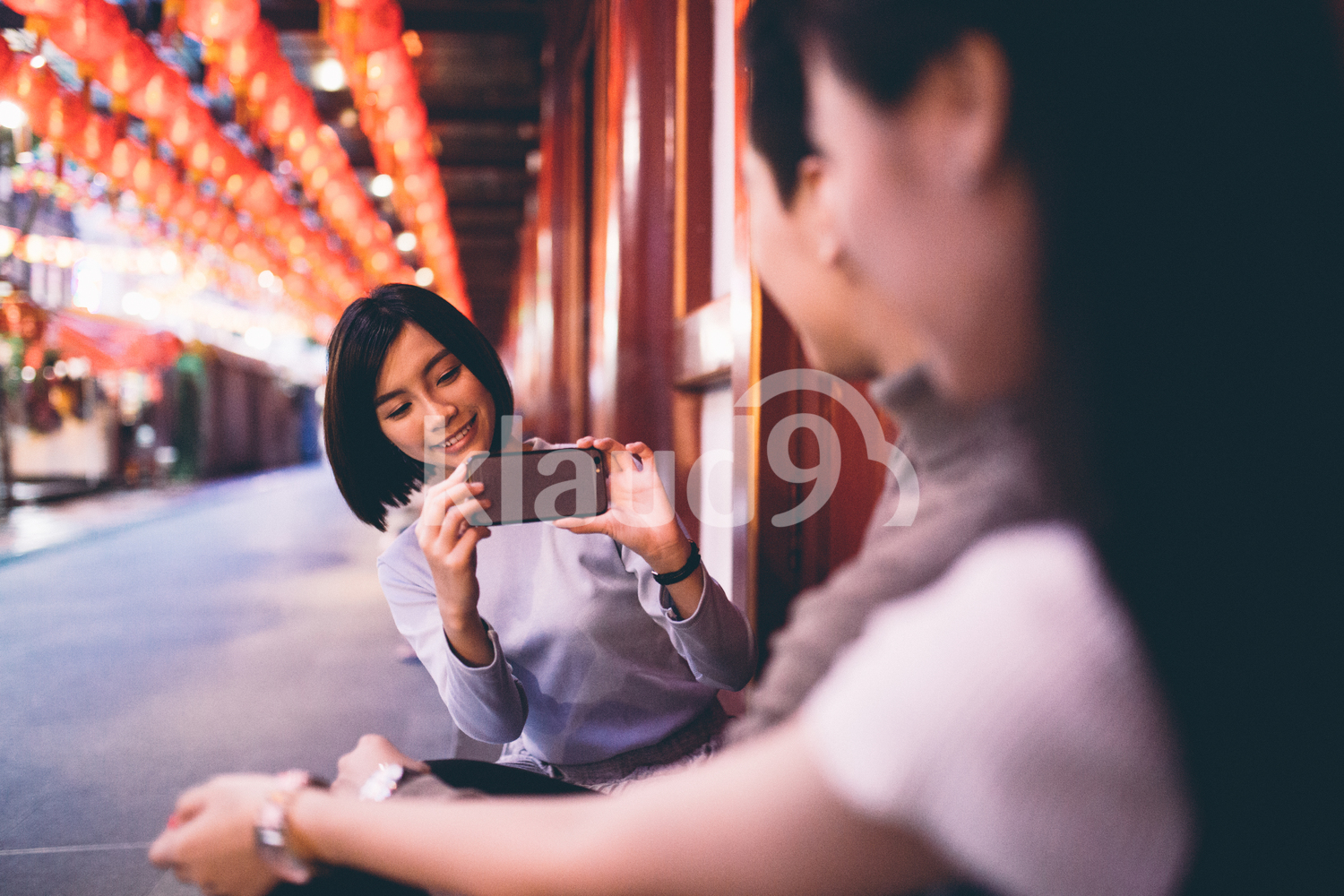 Friends taking a picture in Chinatown, Singapore