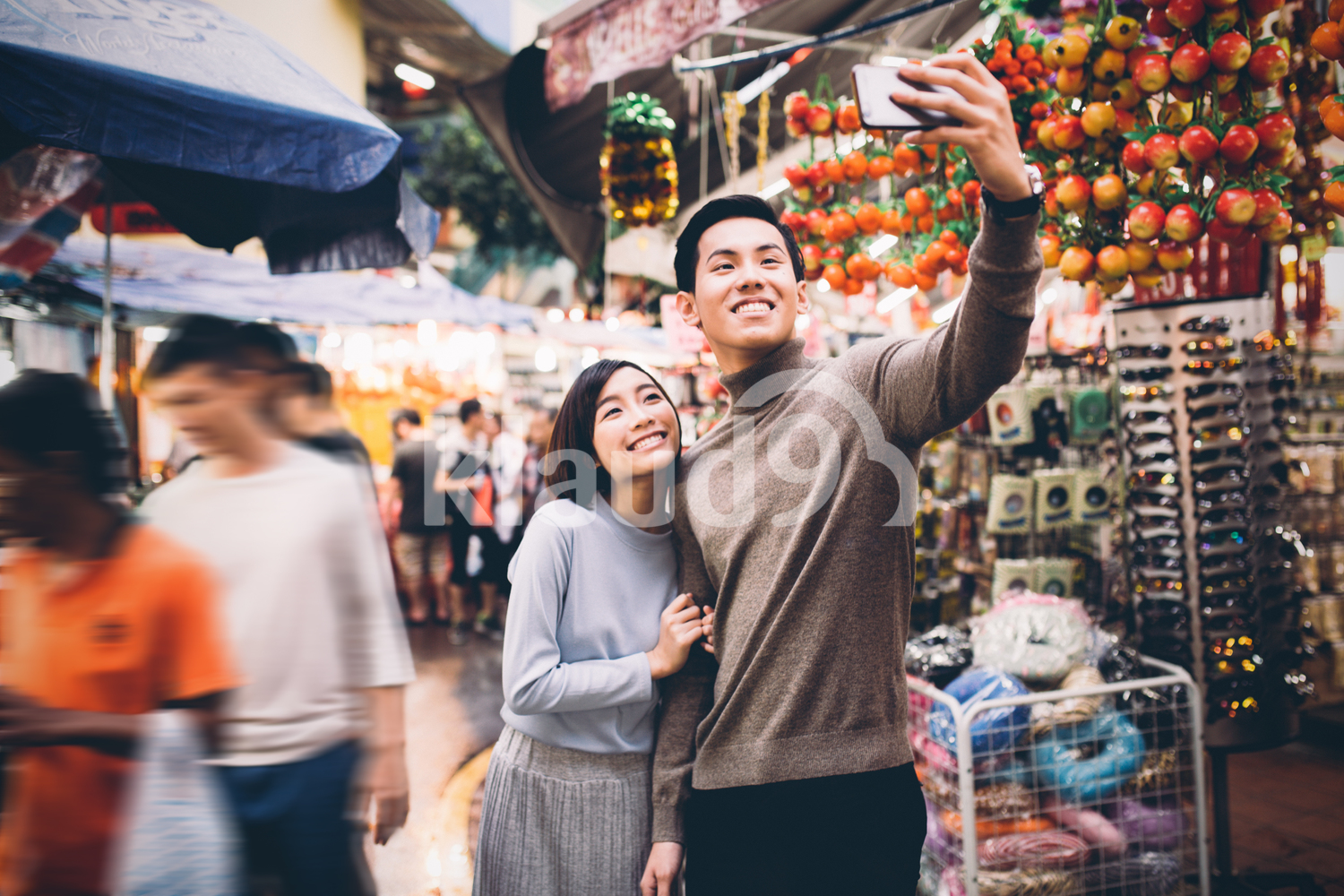 Young couple doing a selfie in Chinatown, Singapore