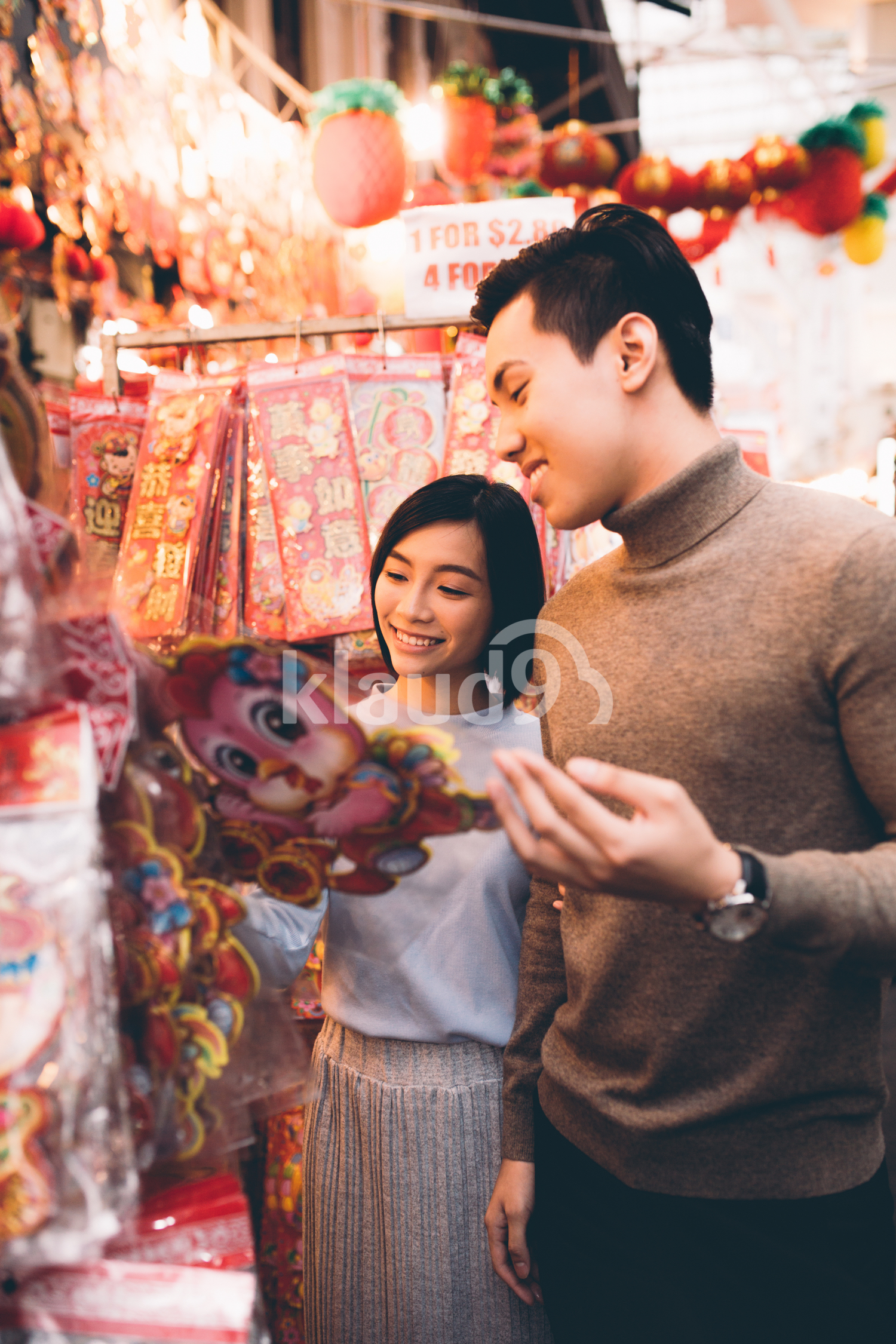 Young millennial couple shopping for Chinese New Year decorations