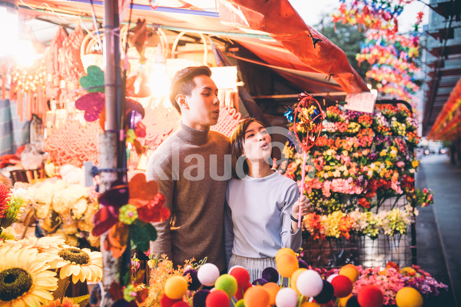 Young Chinese couple shopping in Chinatown over Chinese New Year