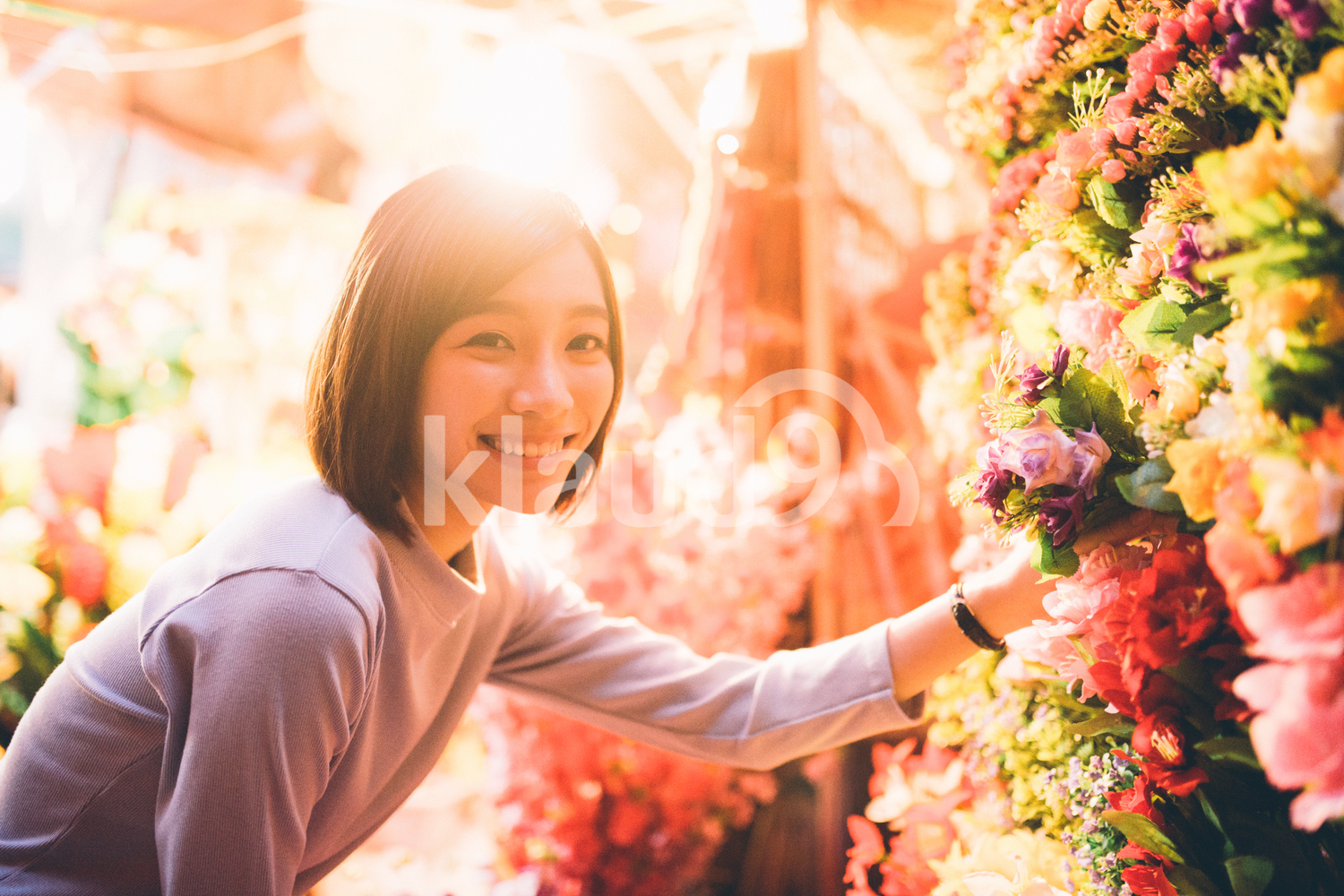 Young lady browsing for flowers in Chinatown, Singapore