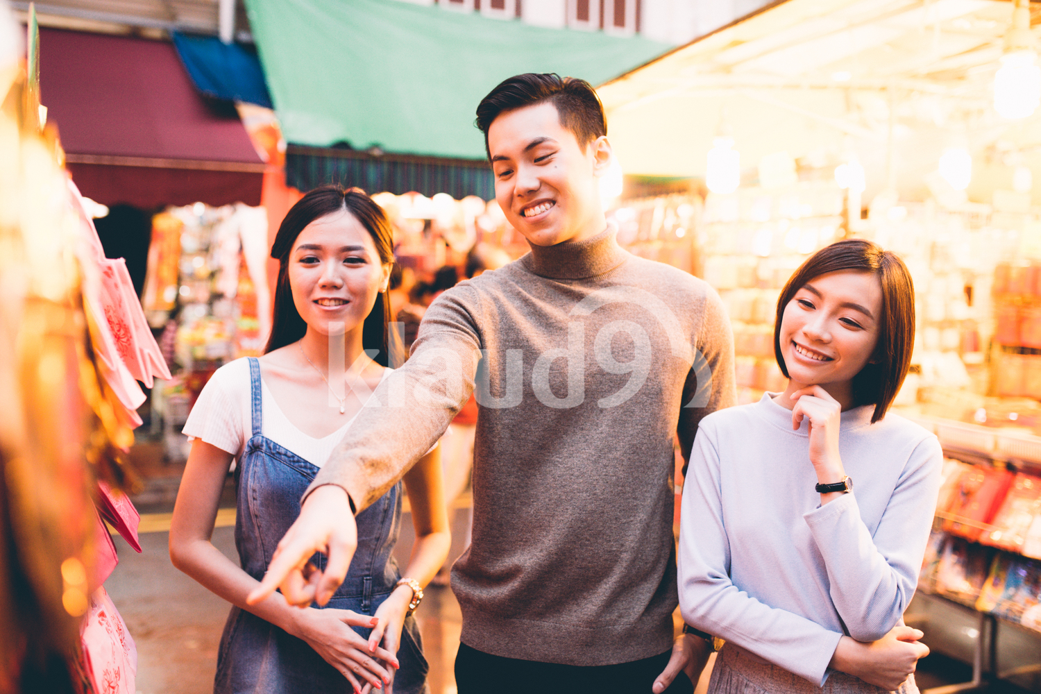 Group of three friends shopping in Chinatown, Singapore
