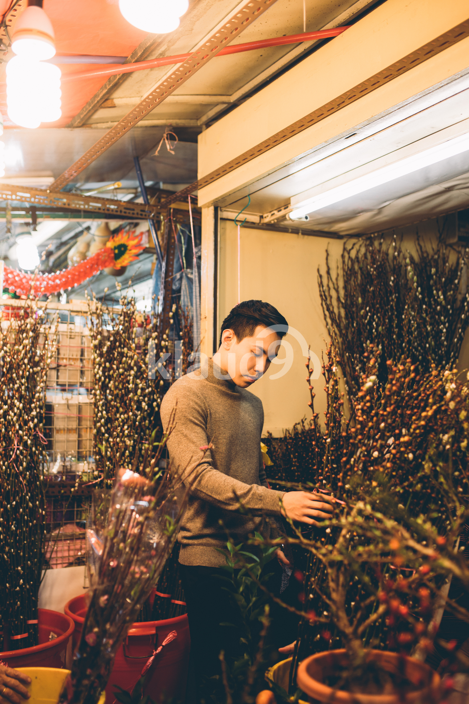 Young man browsing through Pussywillows in Chinatown, Singapore