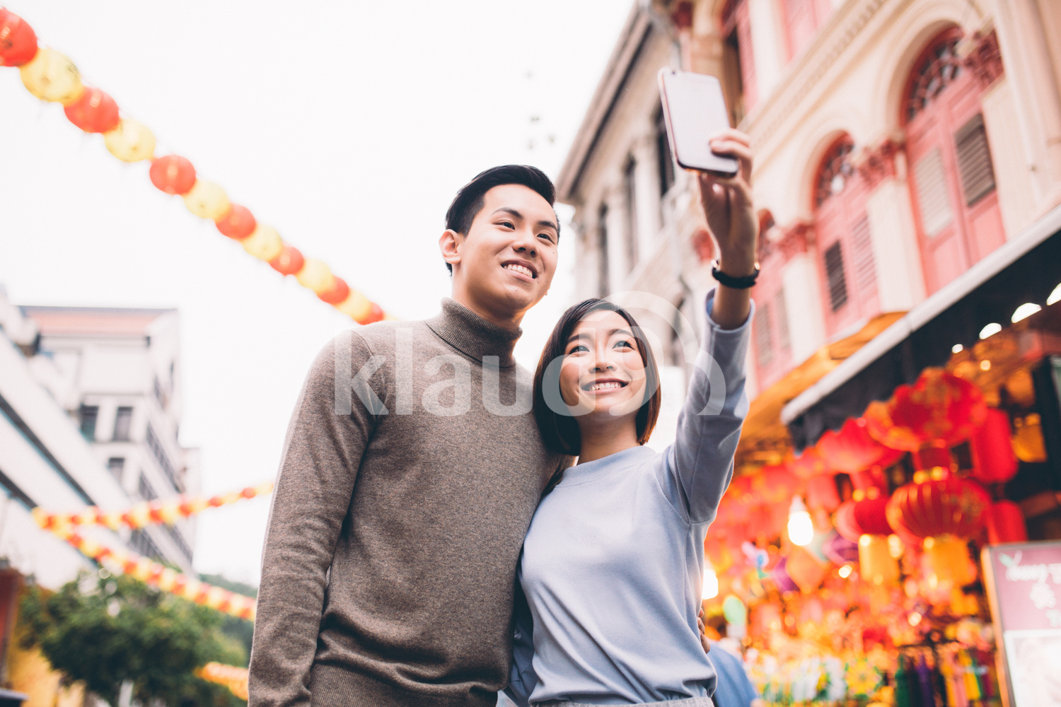 Couple doing a selfie in Chinatown, Singapore