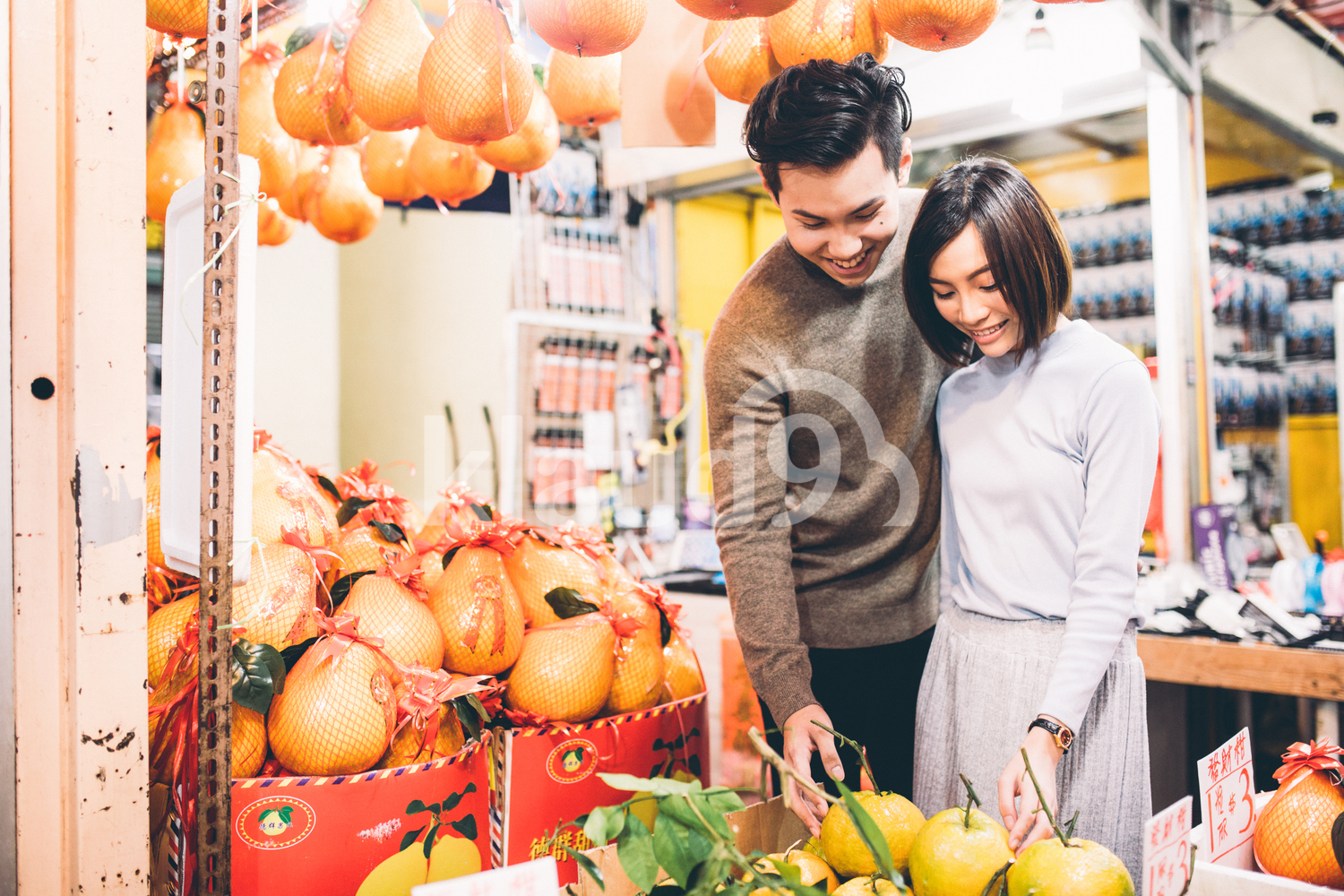 Lovely couple buying fruits in Chinatown, Singapore