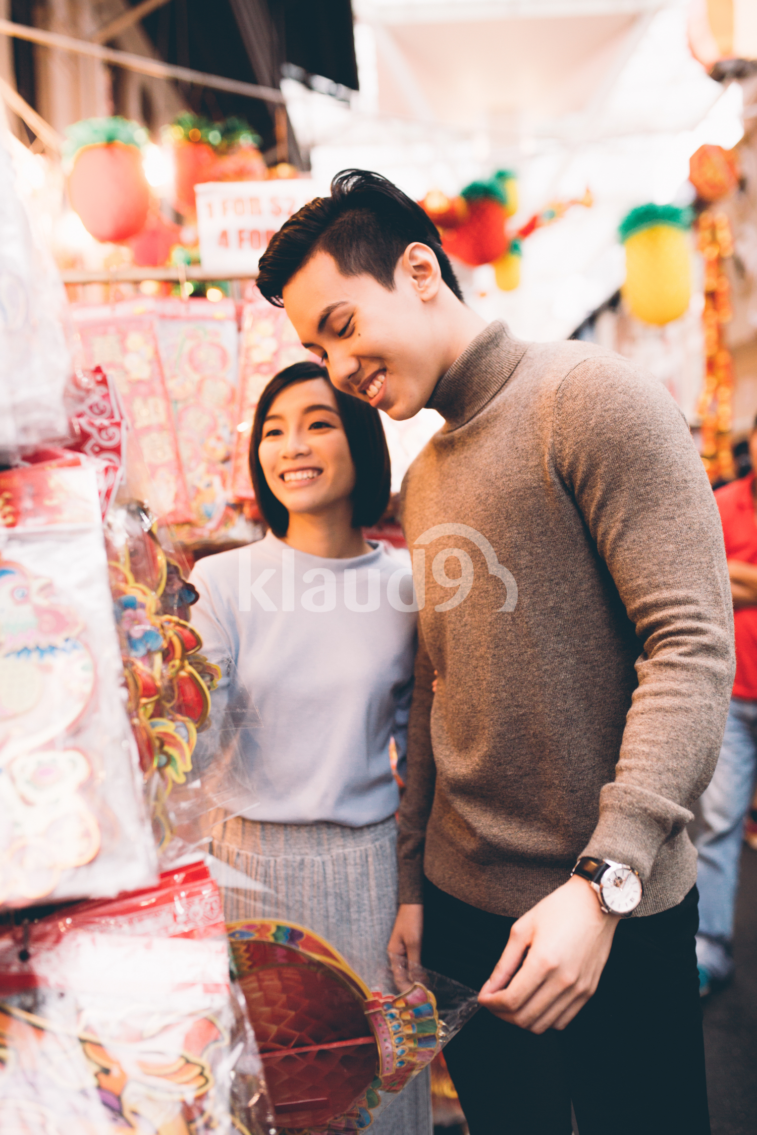 Young couple browsing for Chinese New Year decorations