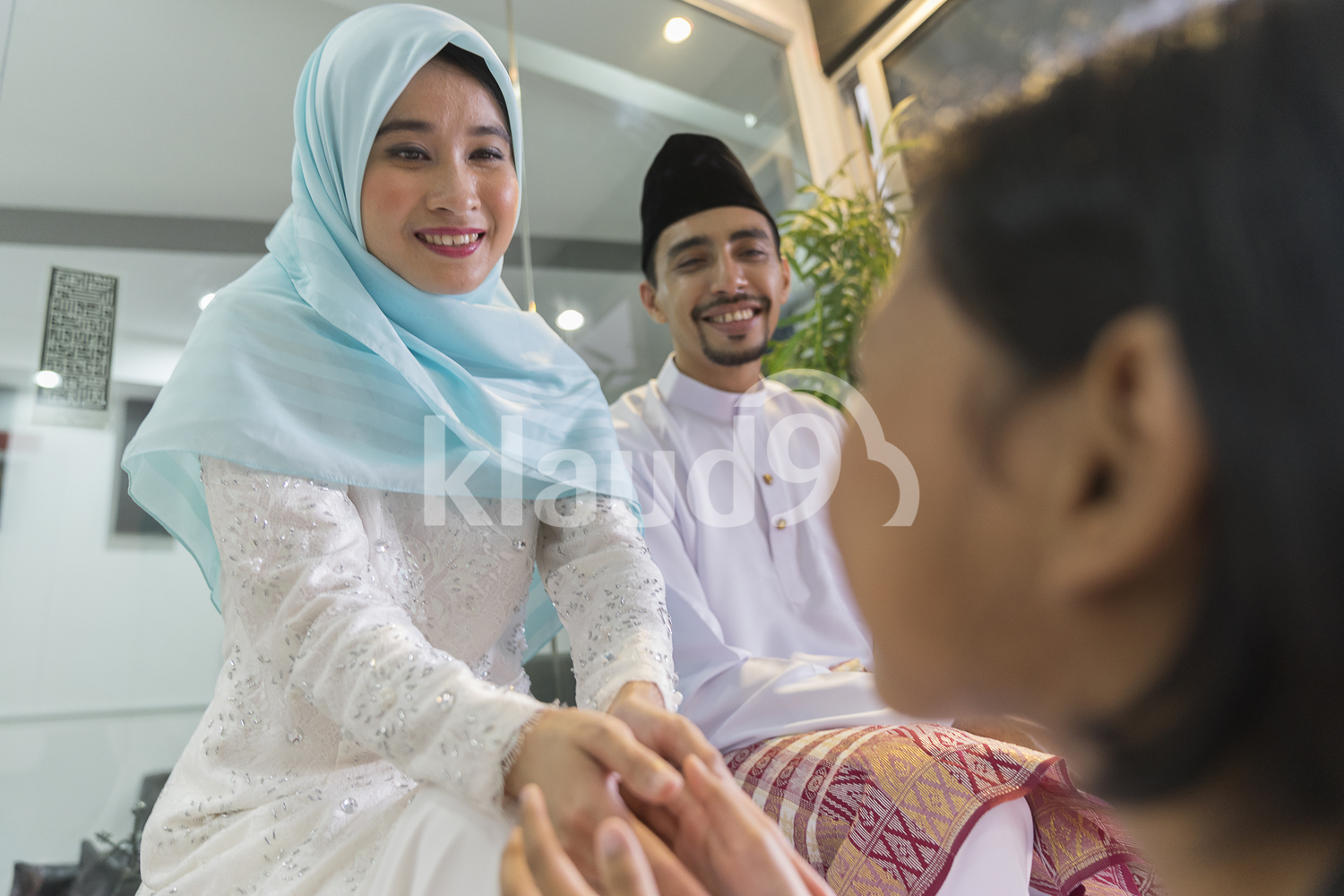 Young girl seeking forgiveness from her beautiful parents