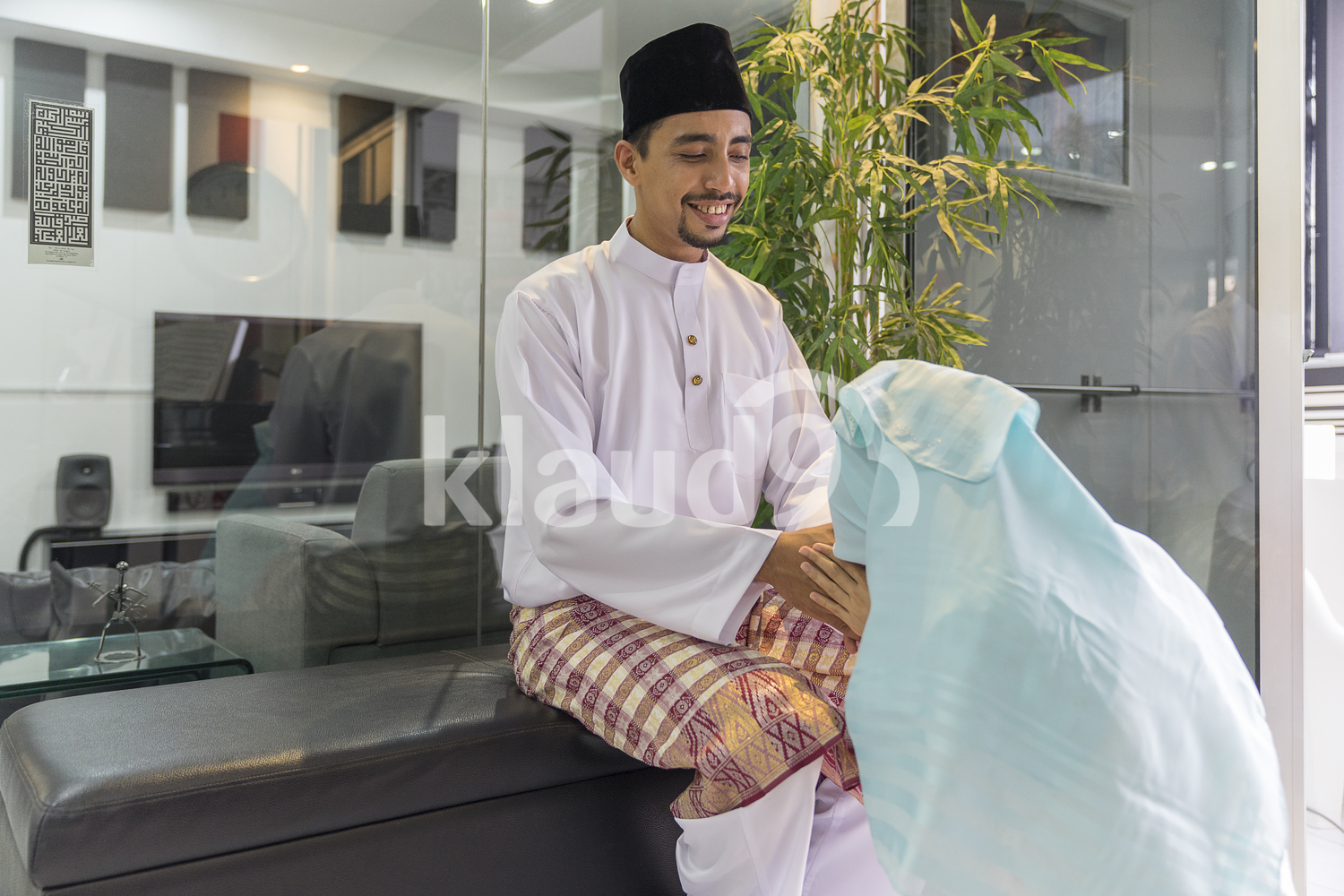 Wife seeking forgiveness from her cheerful husband