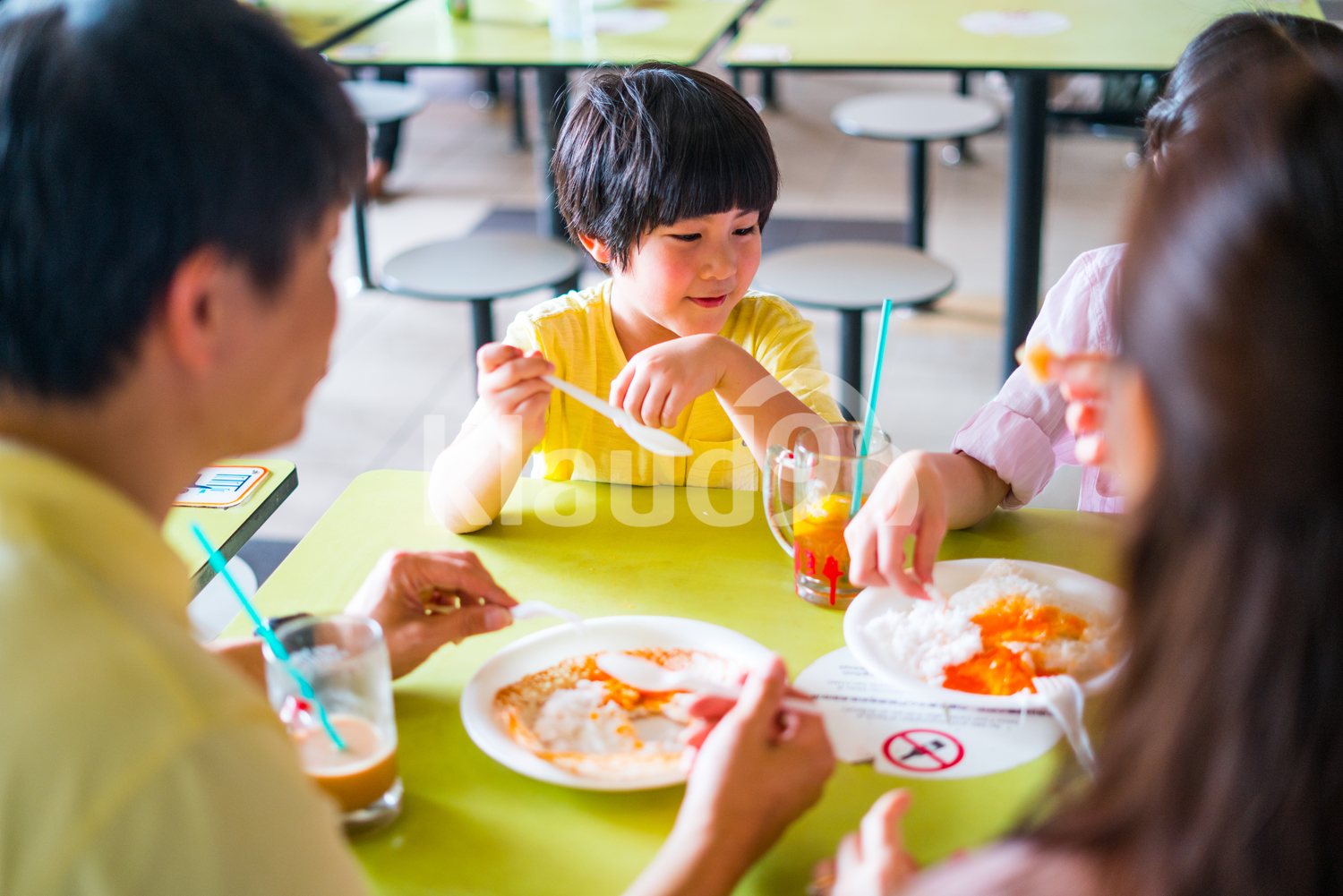 Family eating Indian delicacies  