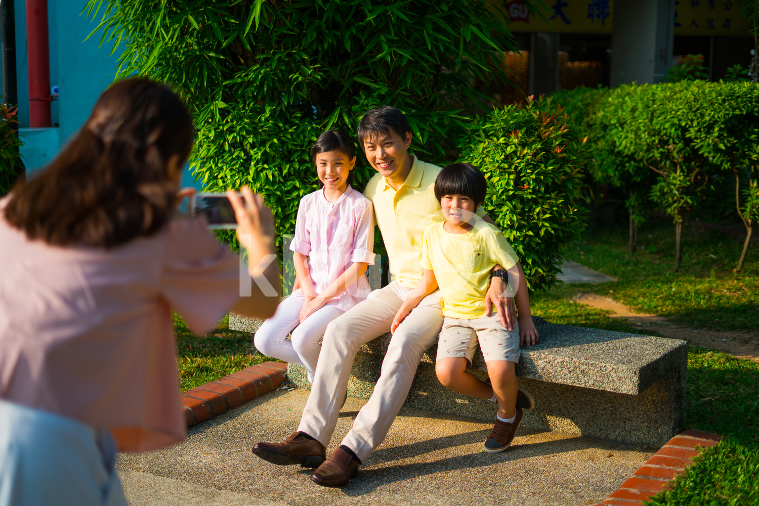 Family of four Taking Photos Together