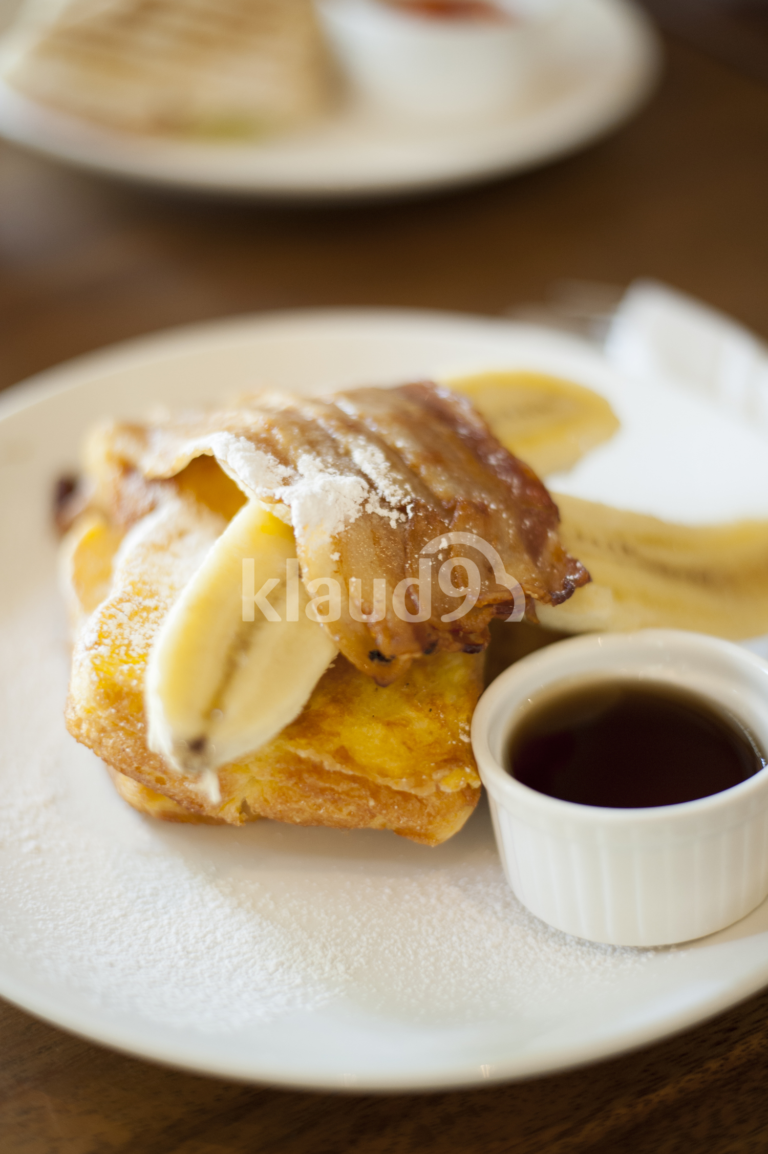Breakfast with toast, eggs, Banana and syrup