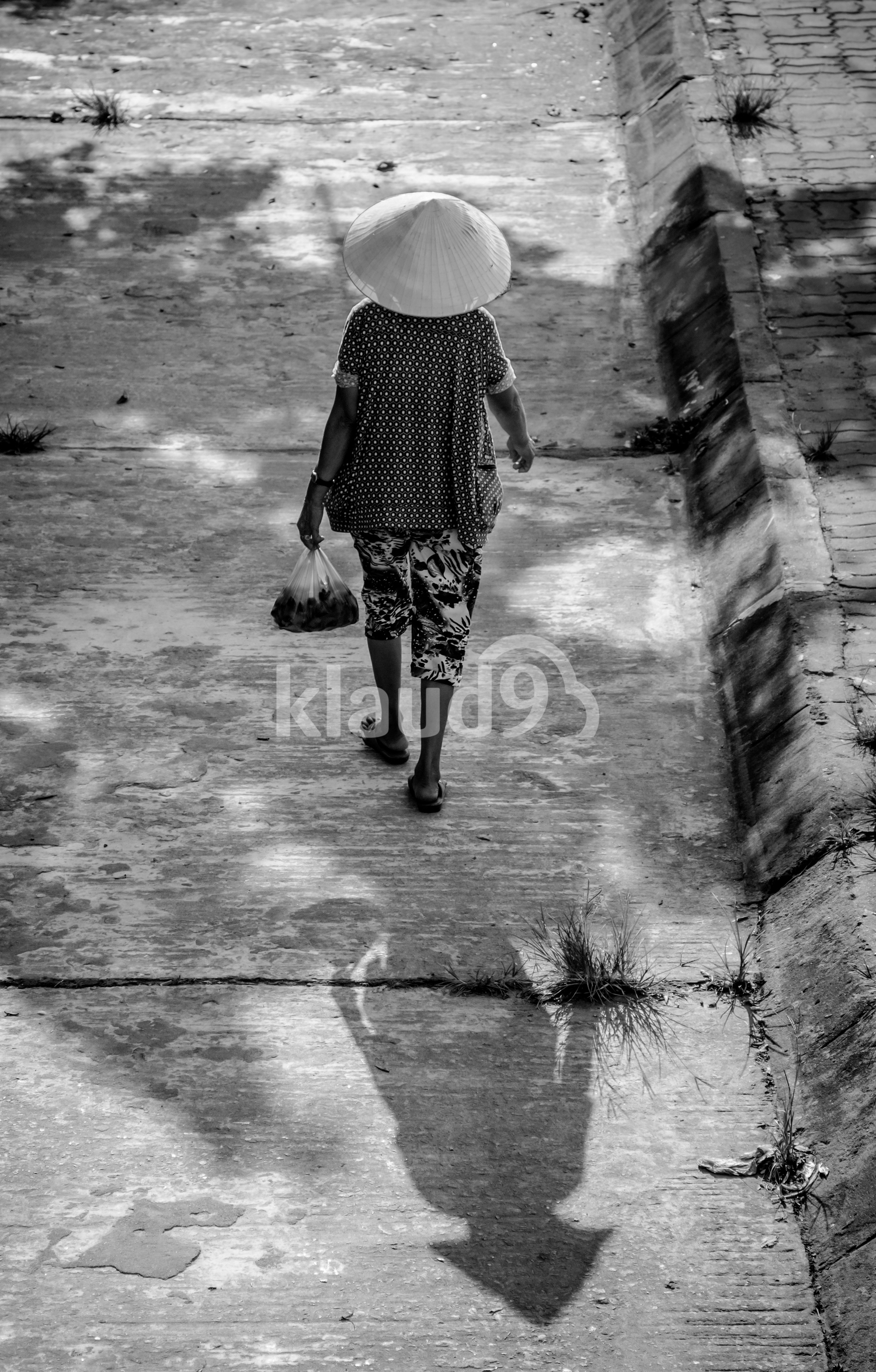 Back view of the shopkeeper in Hoi An