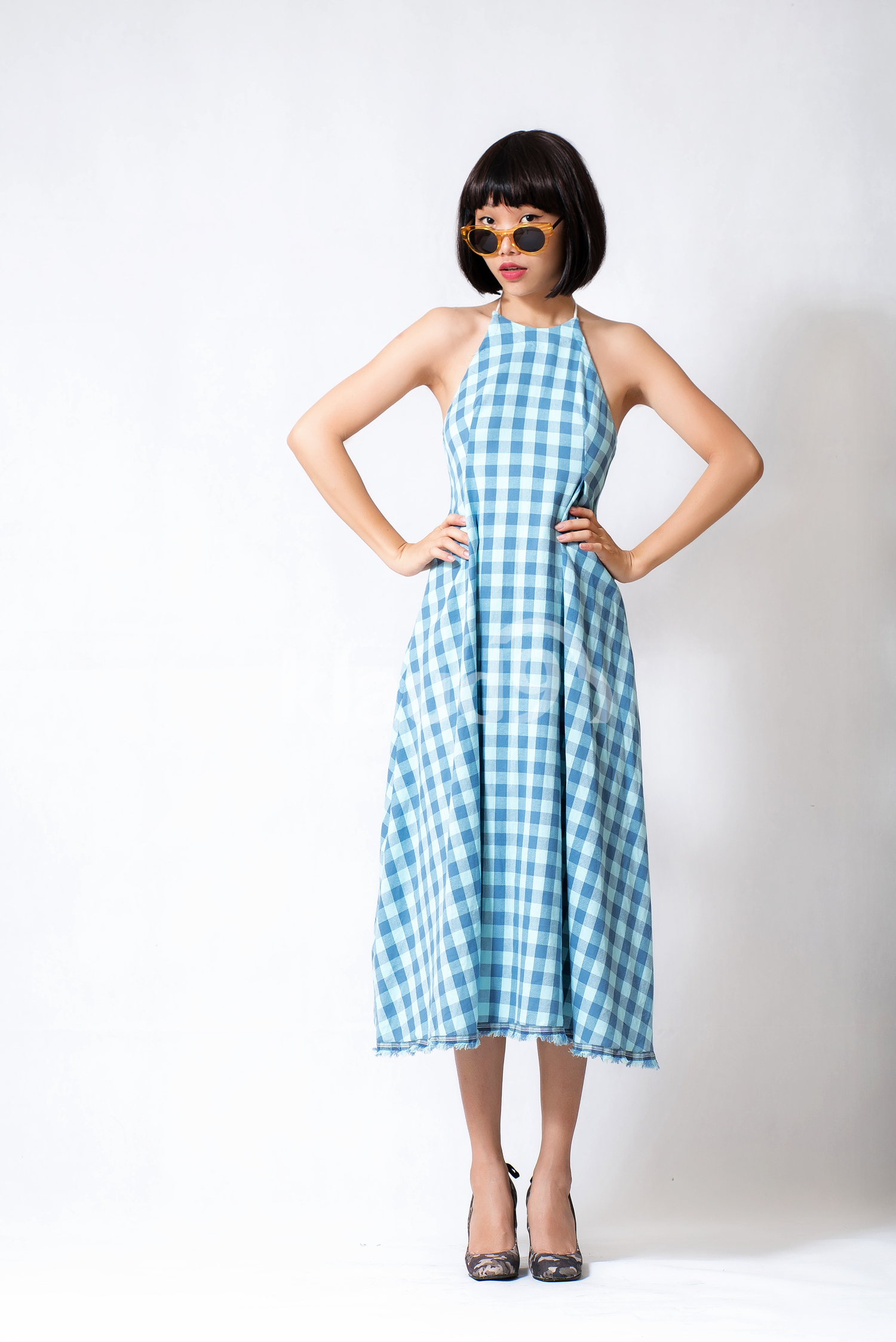 Young Hipster lady in a patterned dress