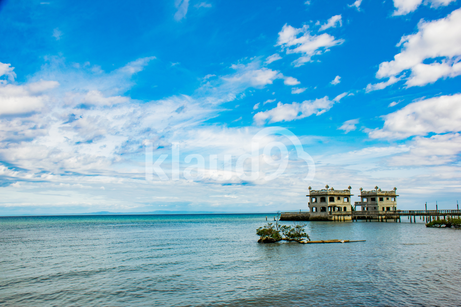 Blue Skies with a jetty in the background