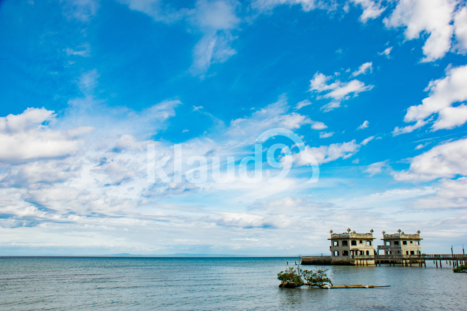 Blue Skies with bridge and jetty in background
