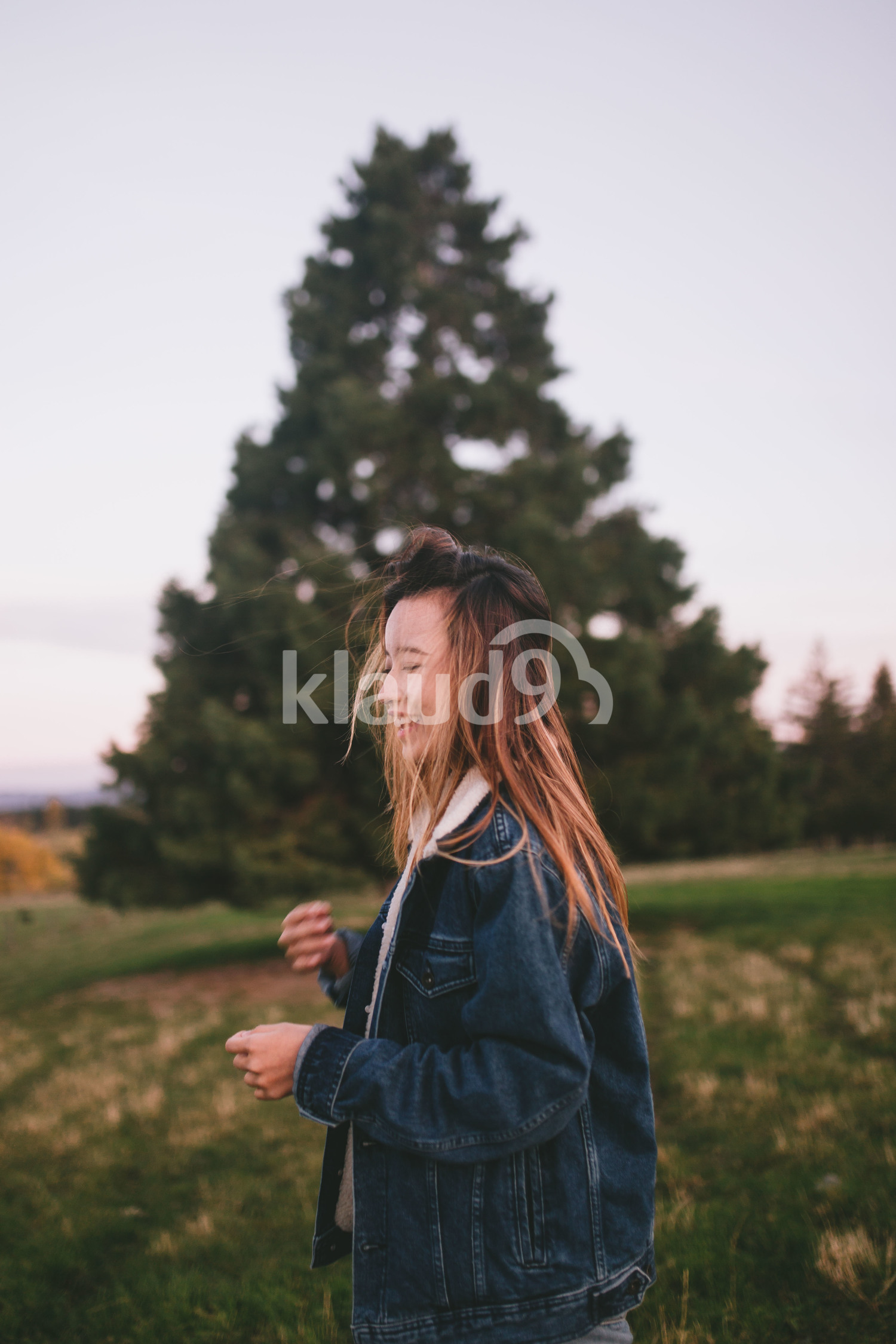 Young woman exploring the forest in Waikato, New Zealand