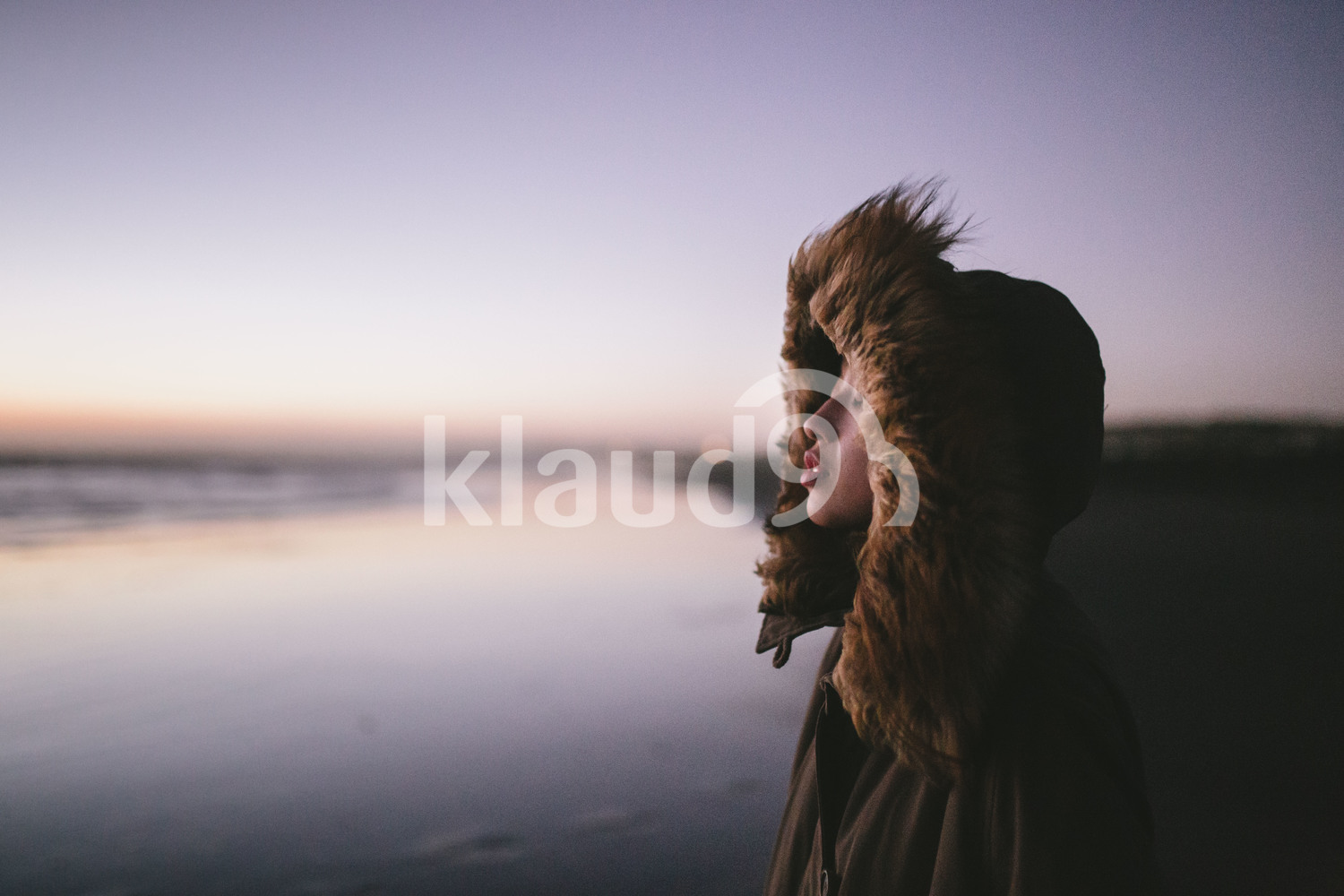 Portrait of young woman at Milford Sound, New Zealand
